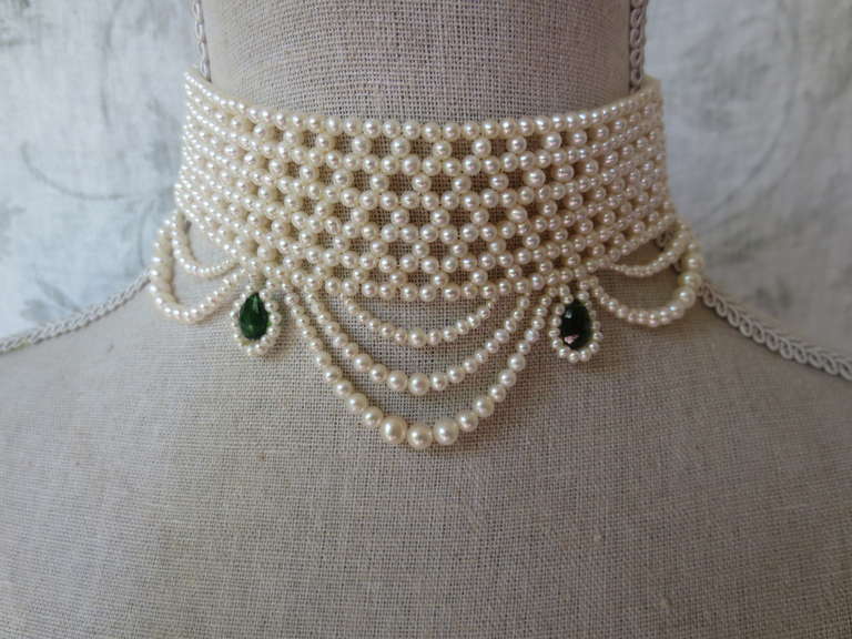 2.5 - 3mm cultured pearls are intricately hand woven to create a delicate lacelike design. Choker measures 13