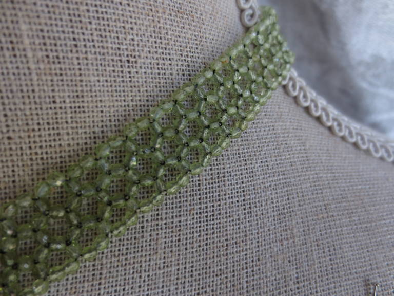 Contemporary Woven faceted Peridot beaded Necklace. With gold clasp