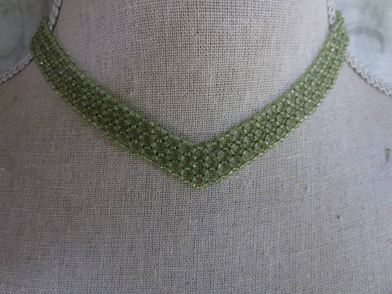 Women's Woven faceted Peridot beaded Necklace. With gold clasp