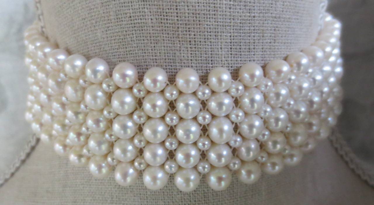 Intricately hand woven choker is made of 6mm and 3mm cultured pearls. Choker measures 13