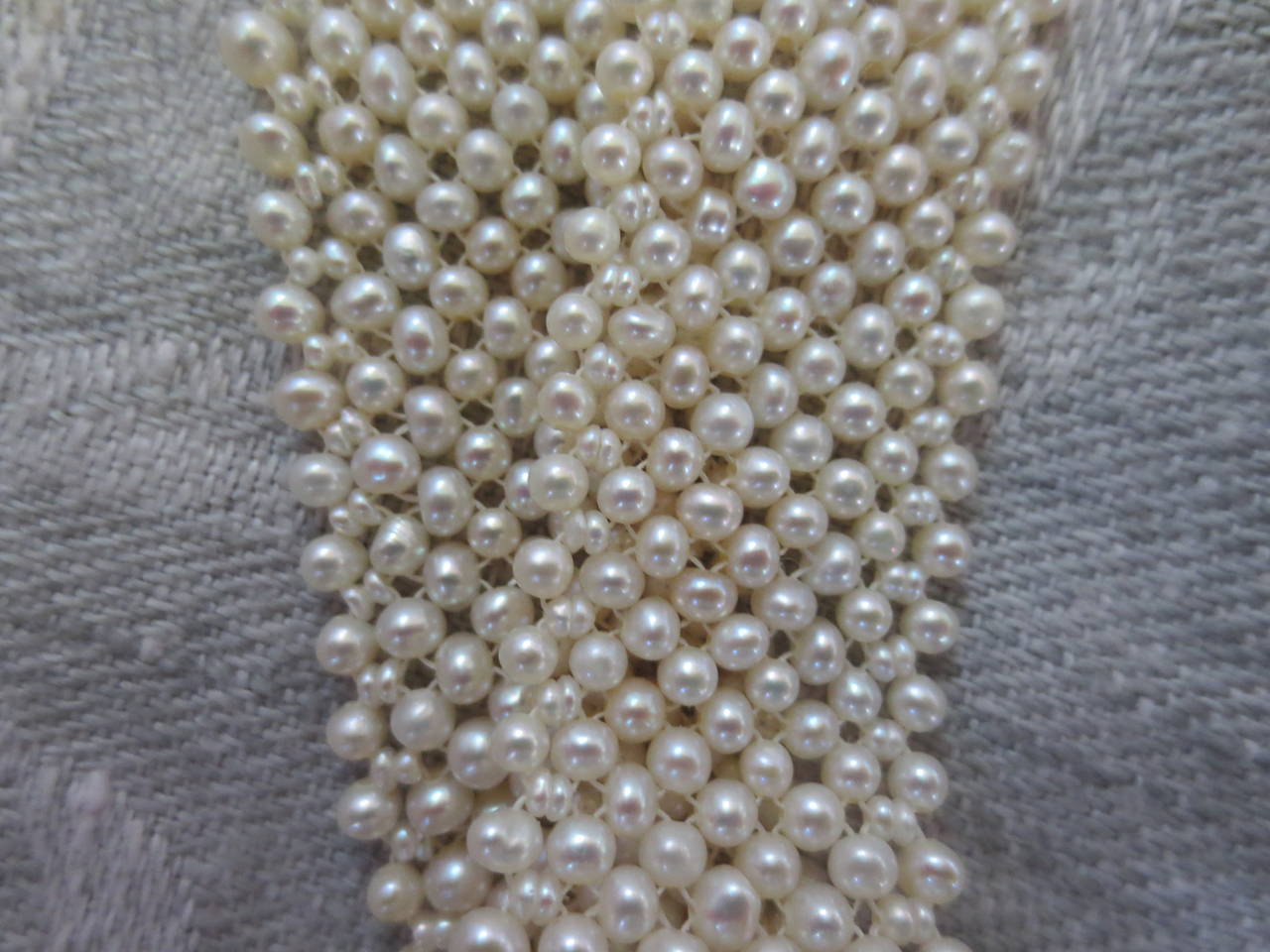 Contemporary Seed Pearl Multi-Strand Woven Bracelet with 14 Karat White Gold Vintage Clasp
