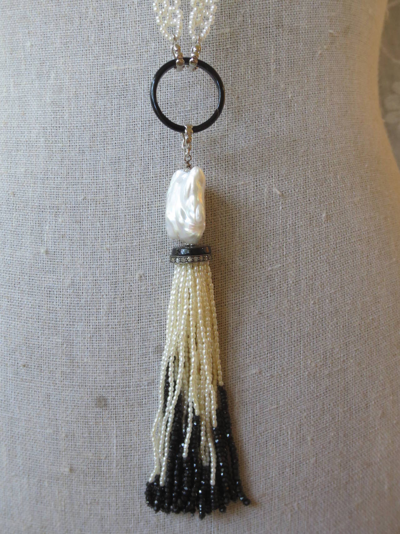 This gorgeous woven white pearl and black onyx sautoir necklace and tassel with diamonds is a Marina J. Jewelry exclusive design. Strands of the tassel are made of fine white pearls and faceted onyx beads draped from the diamond encrusted silver