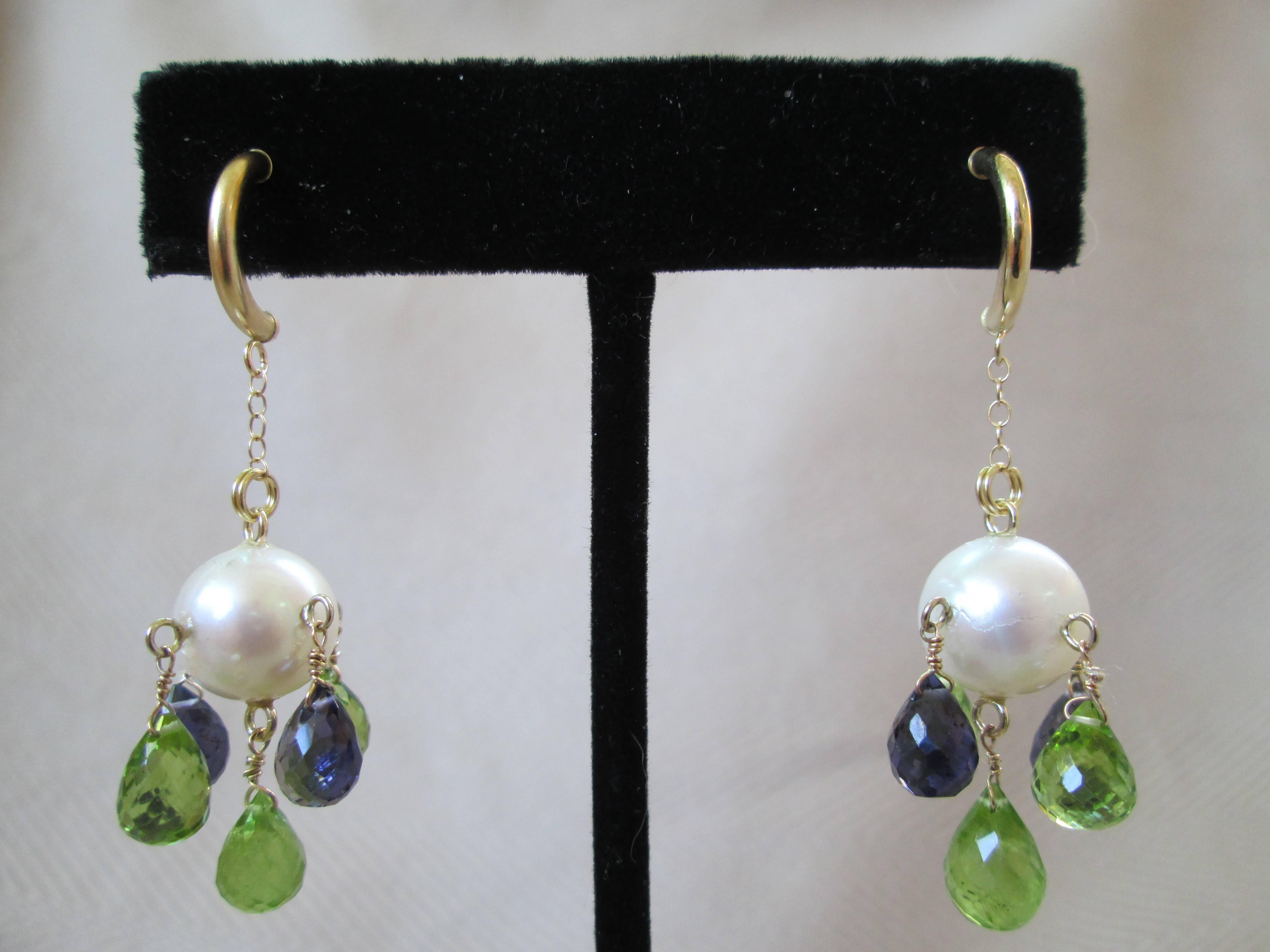 Peridot and Iolite Briolettes dangle from a 9mm cultured Pearl with 14K Yellow Gold findings. These light weight chandelier earrings make an elegant, yet playful statement. Made by Marina J. 2016
****All jewelry is handmade by Marina J. and can be