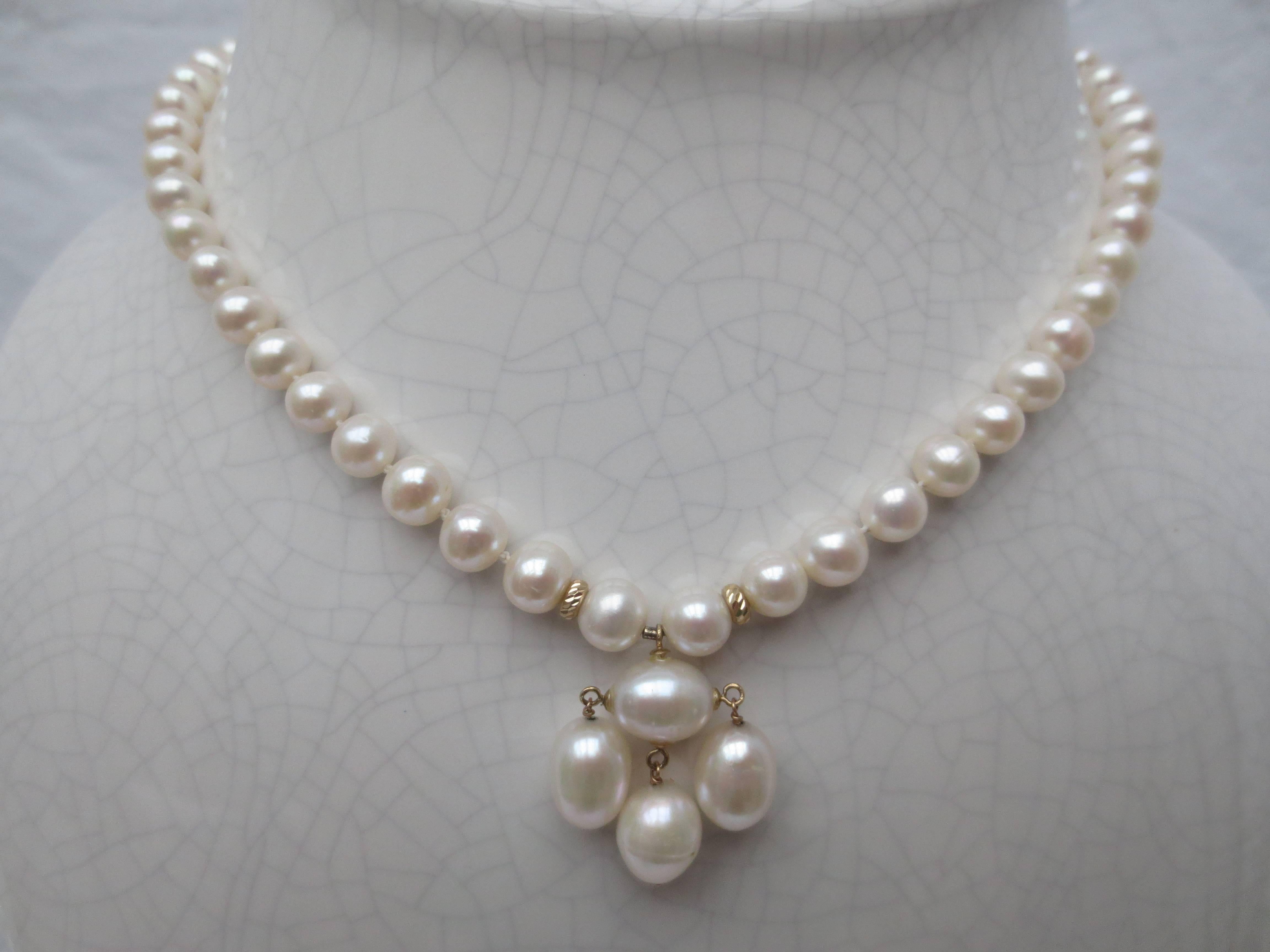 Simple yet gorgeous Graduated Pearl Necklace, hand made by Marina J. This all Pearl necklace features high luster white Pearls that display a beautiful iridescent sheen ranging from 1.5mm - 7mm. Measuring 16.5 inches long, this necklace meets at a