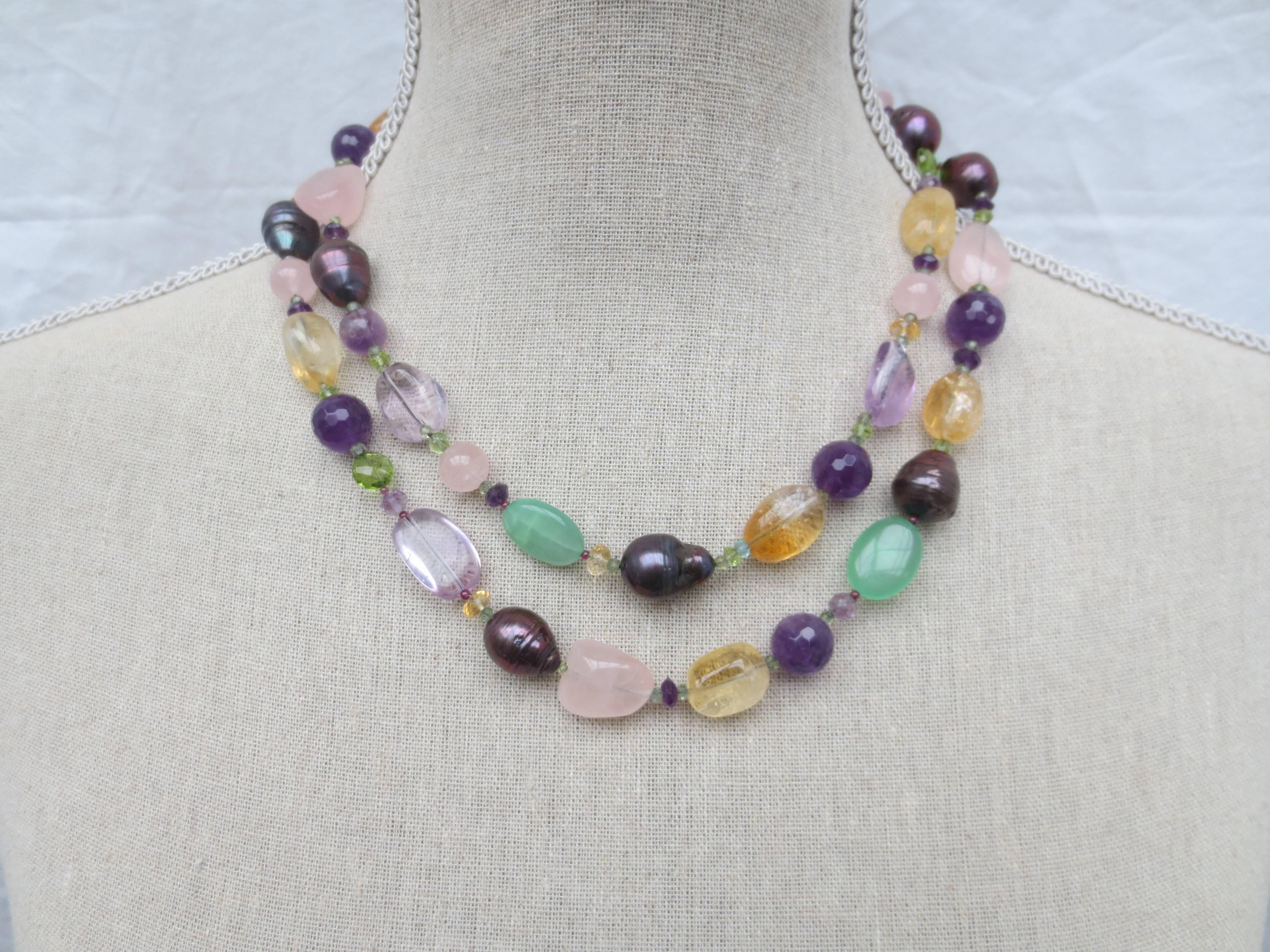 Multi color semi-precious stones citrine, pink quartz, black pearls, amethyst, peridot, florite, green tourmaline, and garnet are combined to create a gorgeous shimmering piece. 

Without tassel, necklace measures 41 inches long. The tassel is