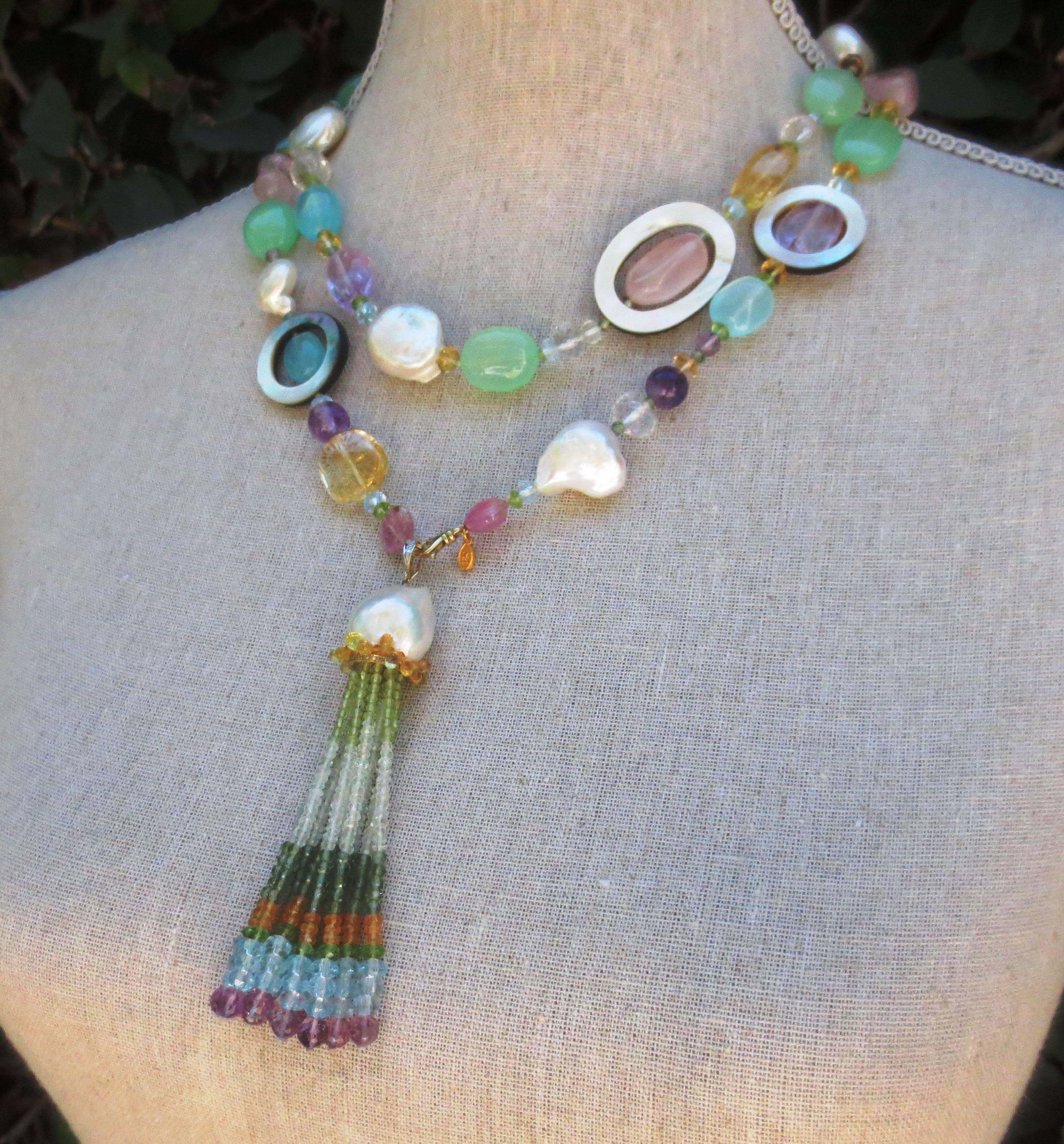 Multi color semi-precious stones: Citrine, Baroque Pearl, Pink quartz, Blue and Green Apatite, Amethyst, Peridot, Florite, and Mother-of-Pearl are combined to create a gorgeous shimmering piece.  

This stunning necklace can be worn long, or