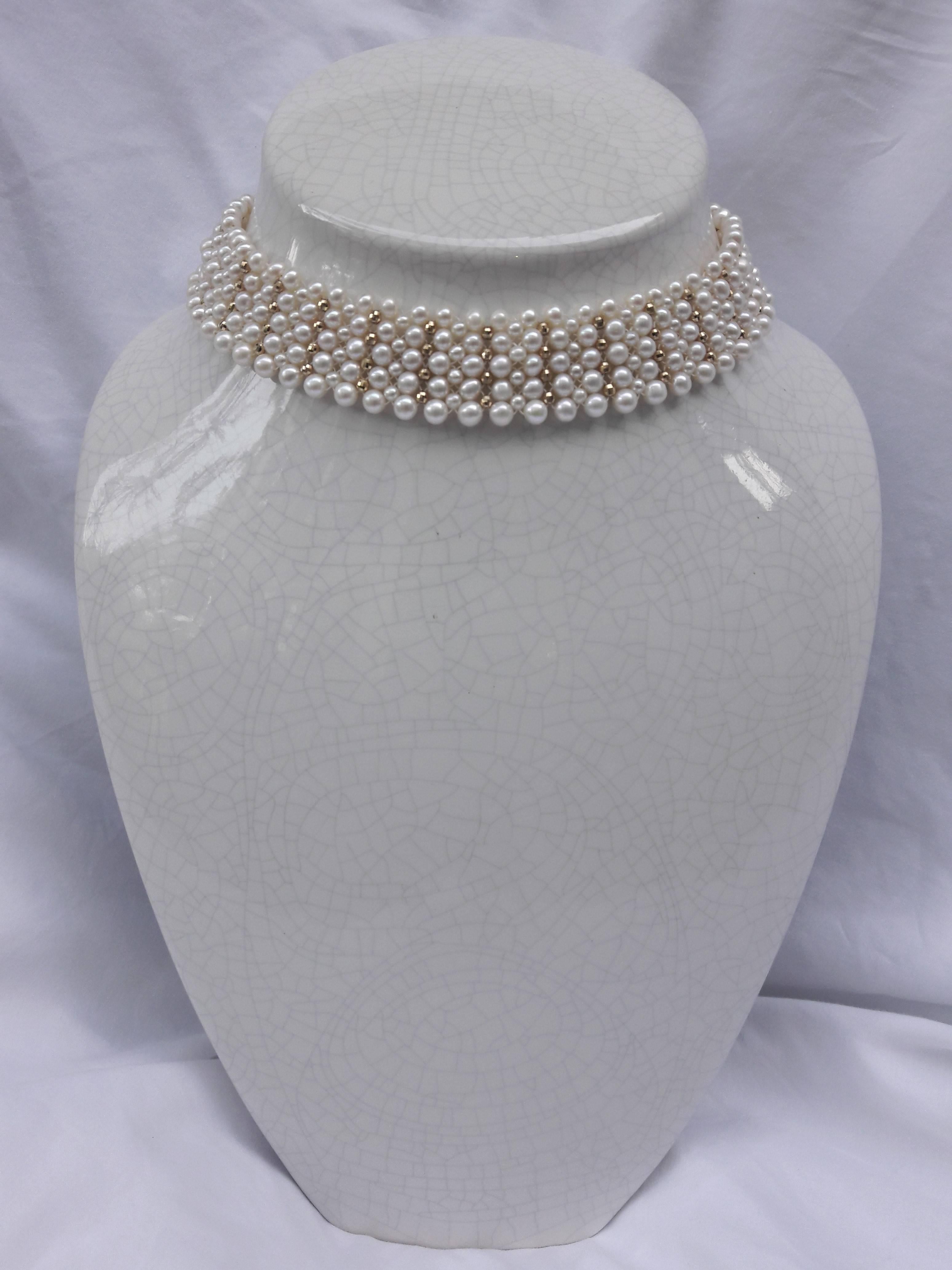 Intricately hand woven choker is made of 3 mm & 4-5 mm pearls with 14 k yellow gold faceted beads. The use of graduated sized pearls allows for natural curvature in design to fit along the form of the neckline. 

Clasp is made of 14 k yellow gold