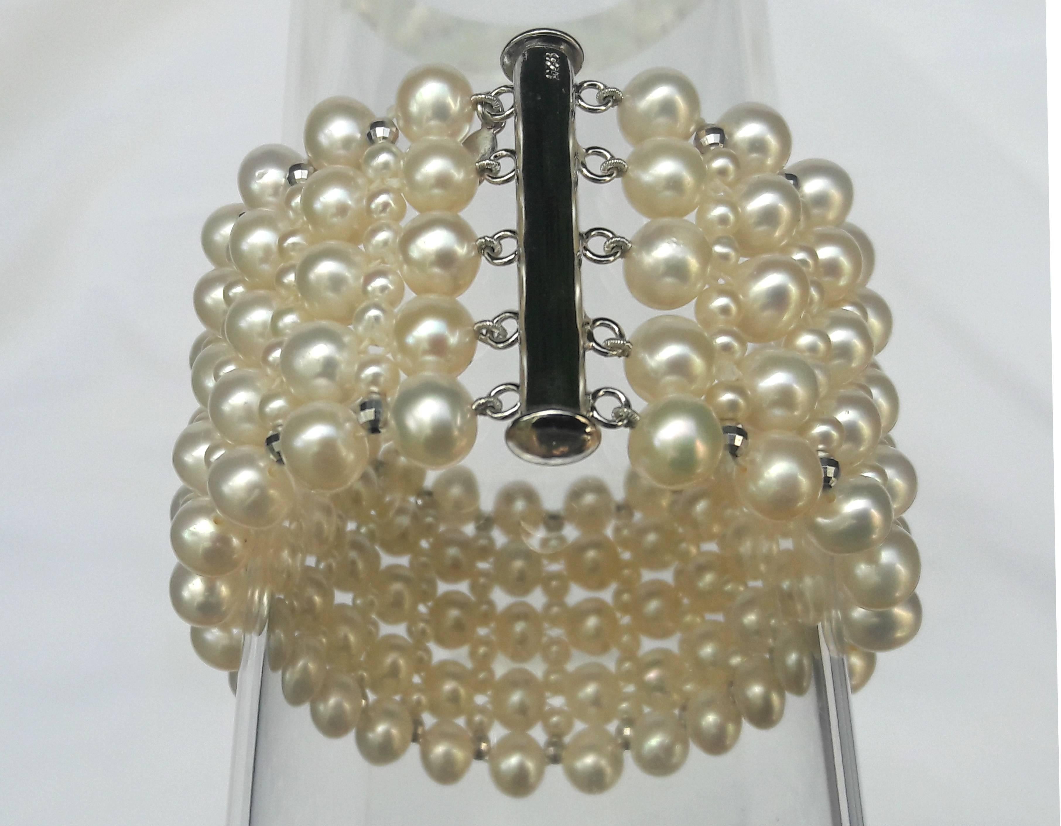 Tightly woven 7 mm and 3 mm pearl bracelet. Sliding clasp and faceted beads are platinum-plated over silver for tarnish resistance and durability. End to end measure 7.75 inches long, however, the fit feels like a 7.5