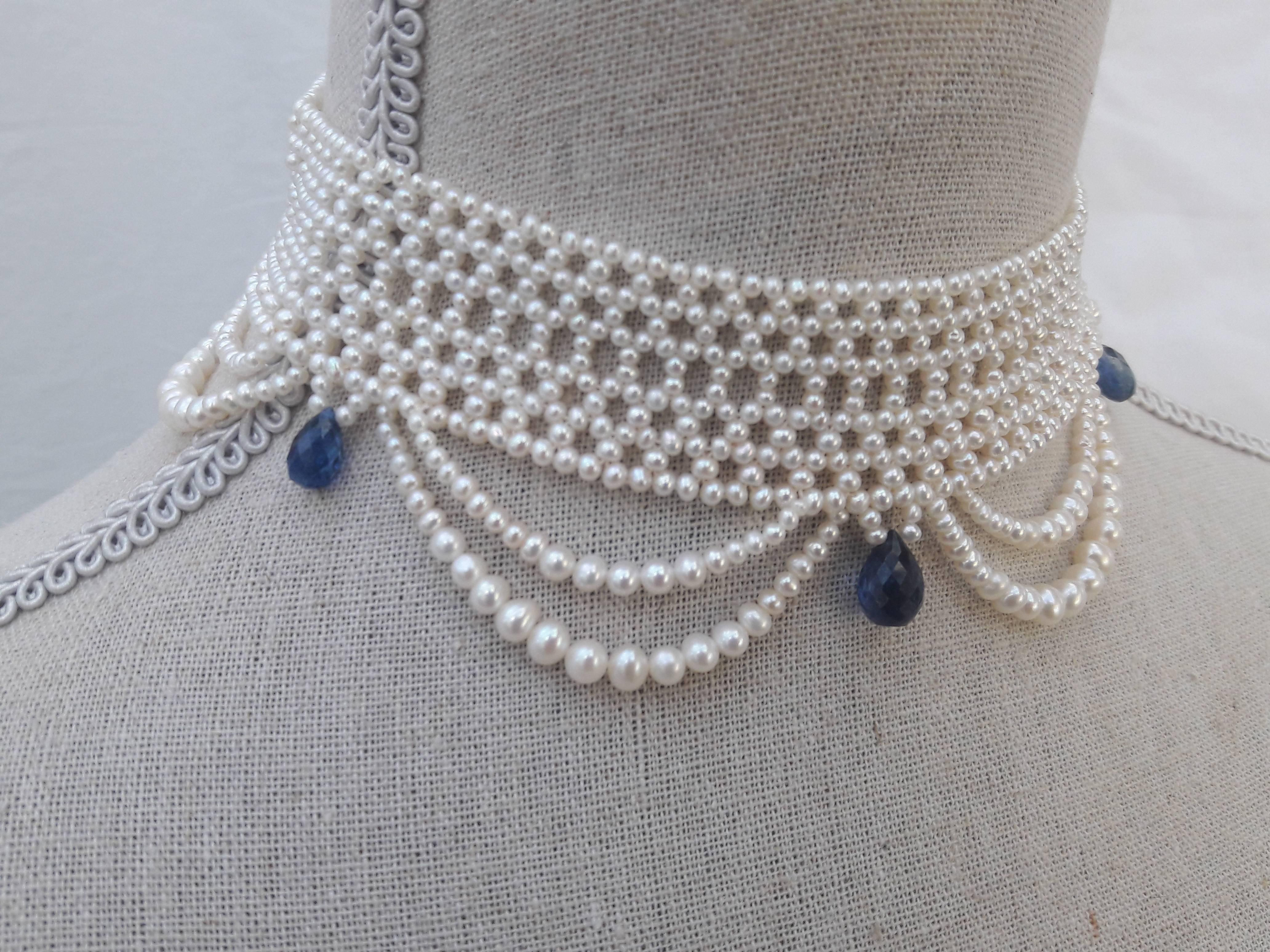 2.5 - 3 mm cultured pearls are intricately hand woven to create a delicate lace-like design. Choker is tapered in design to fit along the curve of the neckline. Clasp is made of 14 K yellow gold plate over sterling silver, and slides very smoothly