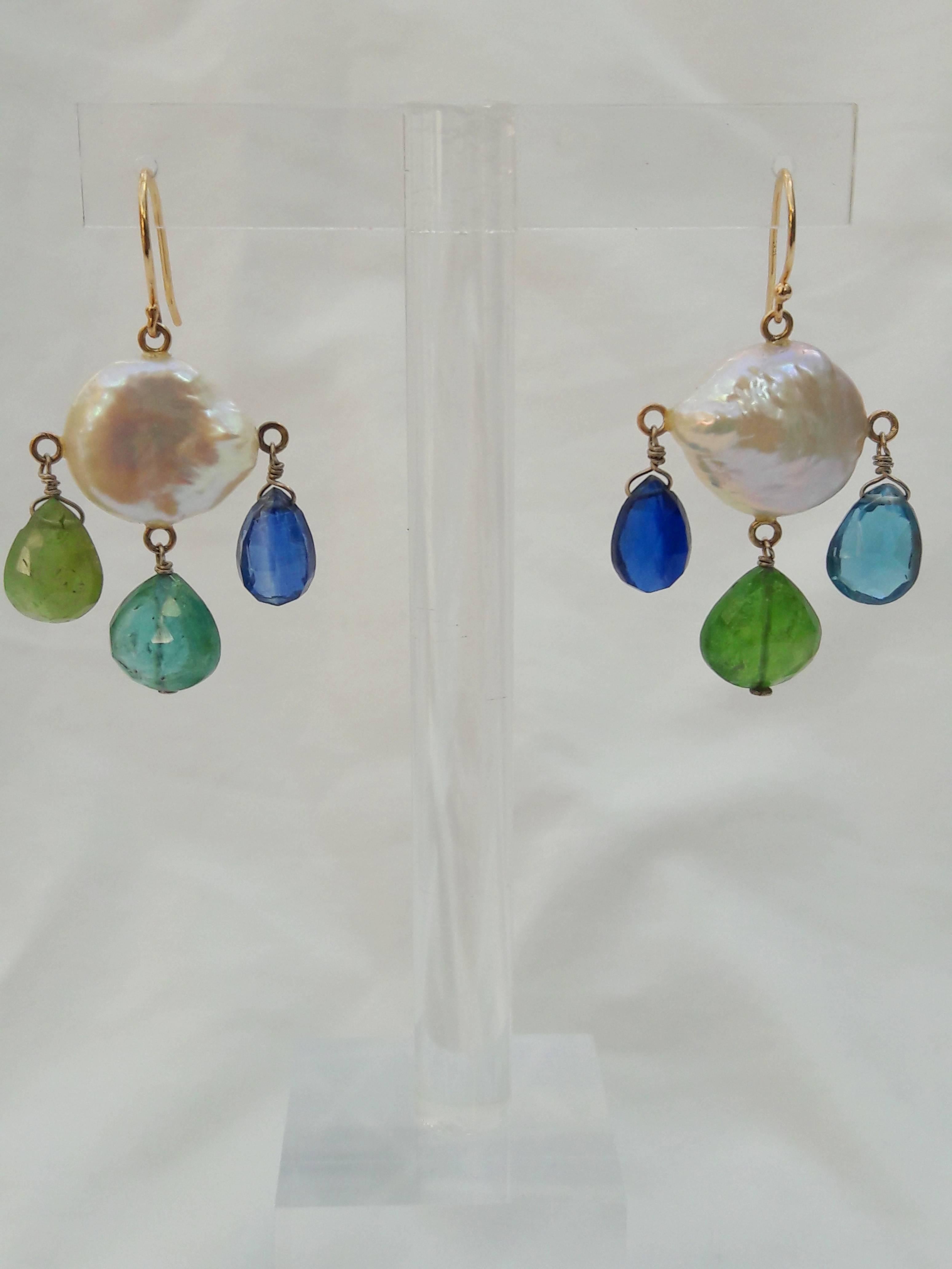 Beautiful pair of multi colored Chandelier earrings by Marina J. This pair is made using all solid 14k Yellow Gold wiring and organic stones. Two large flat coin Pearls with wild iridescence and sheen are used in this pair. One earrings displays