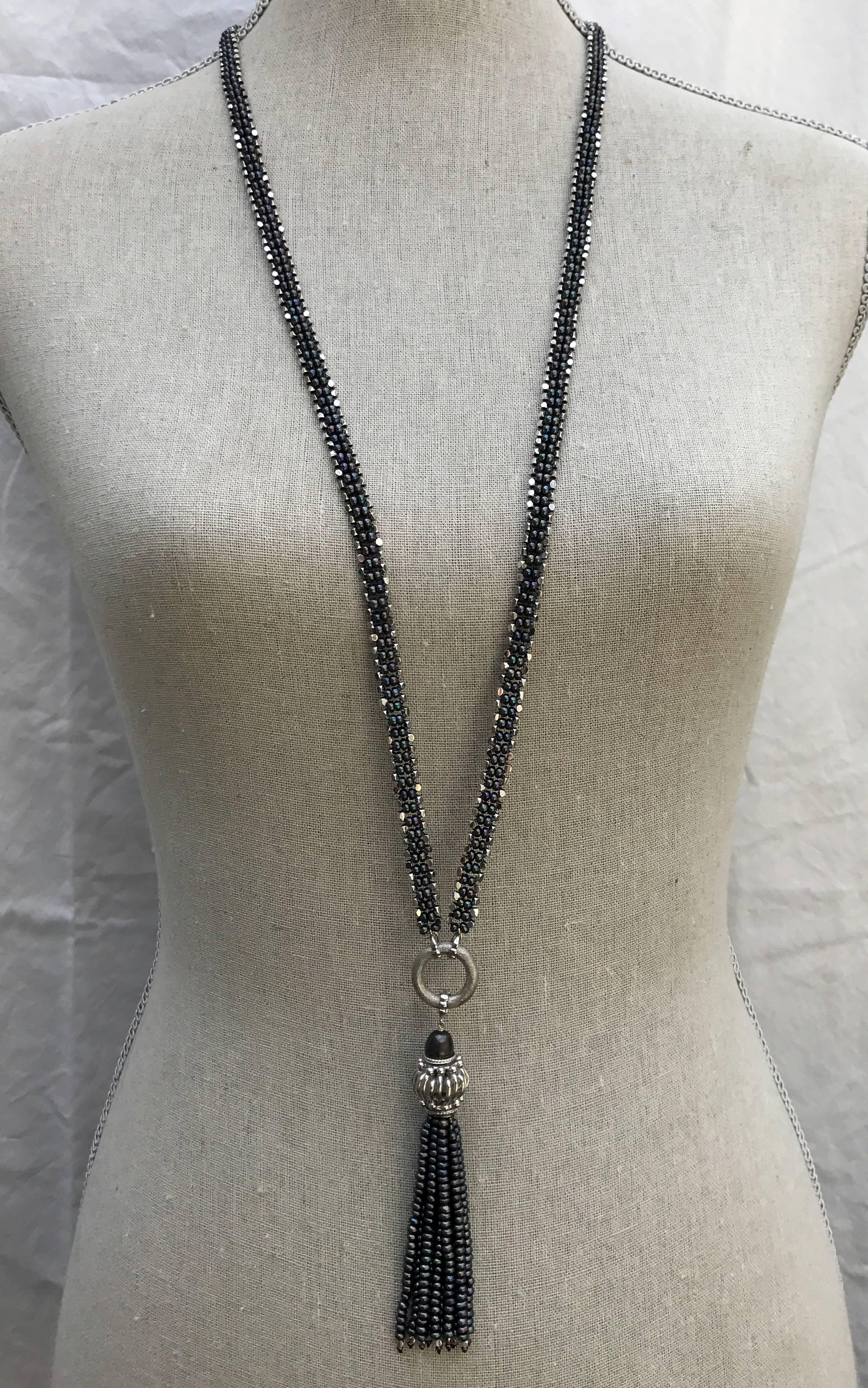 Marina J 38 inch black pearl and sterling silver beads sautoir with 4 inch black pearl & silver tussle. It offers wide variety of options to wear with or without a tussle. Sautoir's unique design is complimentary to any body shape or skin color.