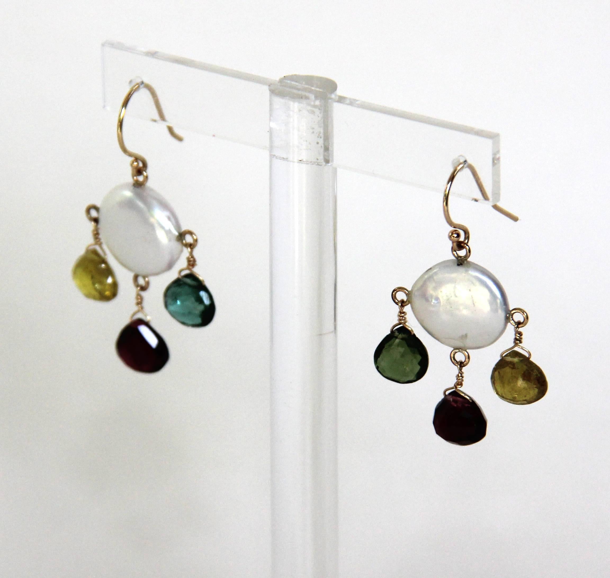 Beautiful pair of Chandelier Earrings by Marina J. This One of a Kind pair feature multi colored Tourmaline in a faceted Teardrop Briolette cut. The Tourmaline illuminate with radiant color when hit with light due to their translucent nature. The