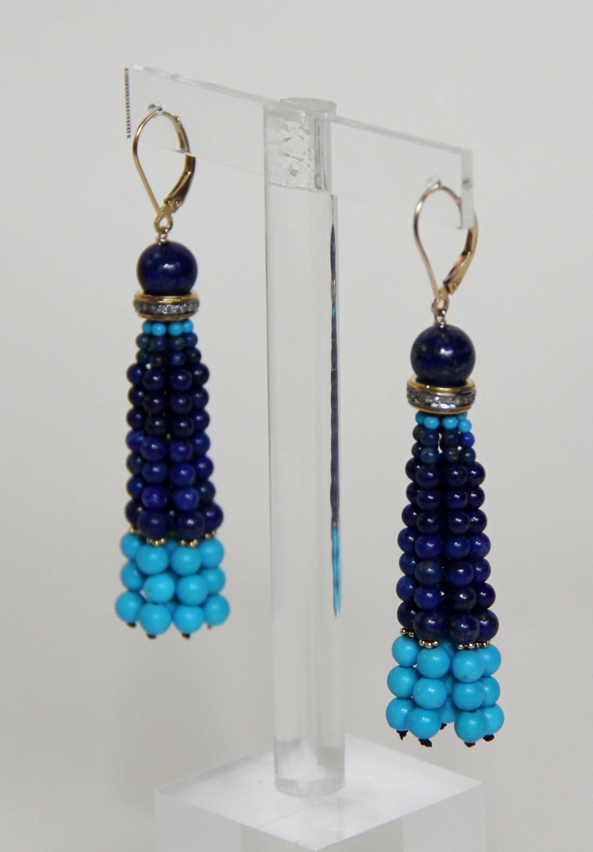  Multi-strand tassel earrings with small, fine, turquoise beads. Tassels suspended from 6mm Lapis Lazuli bead by a silver gold plated rondelle with diamonds. 14k yellow gold beads highlight contrast between 3 mm turquoise beads and 2.5 mm lapis