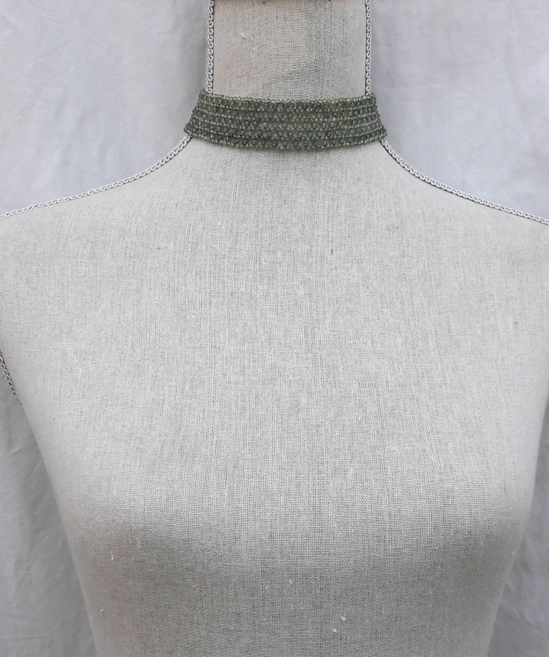 The faceted woven green onyx beaded choker was made by Marina J with tapered design and yellow gold plated silver clasp. The translucent green color of the onyx looks ethereal and lays lightly on the skin. This delicate choker has a gold plated