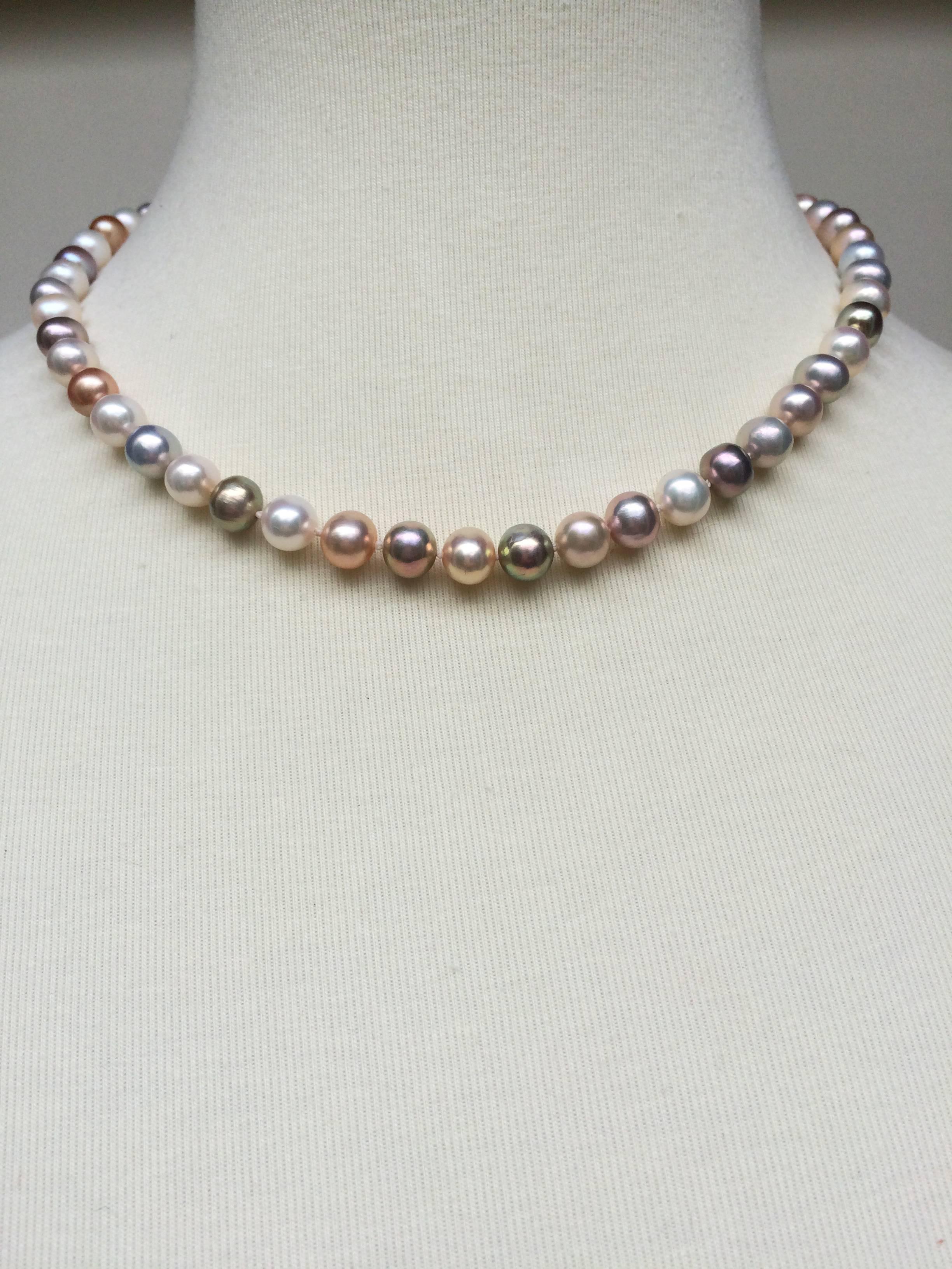 These 2 unique necklaces are composed of a long strand of slightly graduated pearls (4 mm-6.5 mm), strung together with various color pearls that bring out the beauty of any skin tone. Each necklace has a small 14 k yellow gold clasp. Custom length