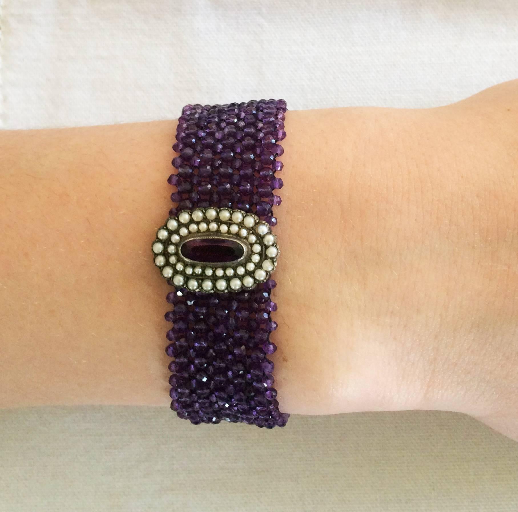 A beautiful and delicate brooch is redesigned as the centerpiece of this bracelet. Tiny 1-1.5 mm faceted light purple amethyst beads are delicately hand-woven together creating a design reminiscent shimmering fabric.  The secure sliding clasp is