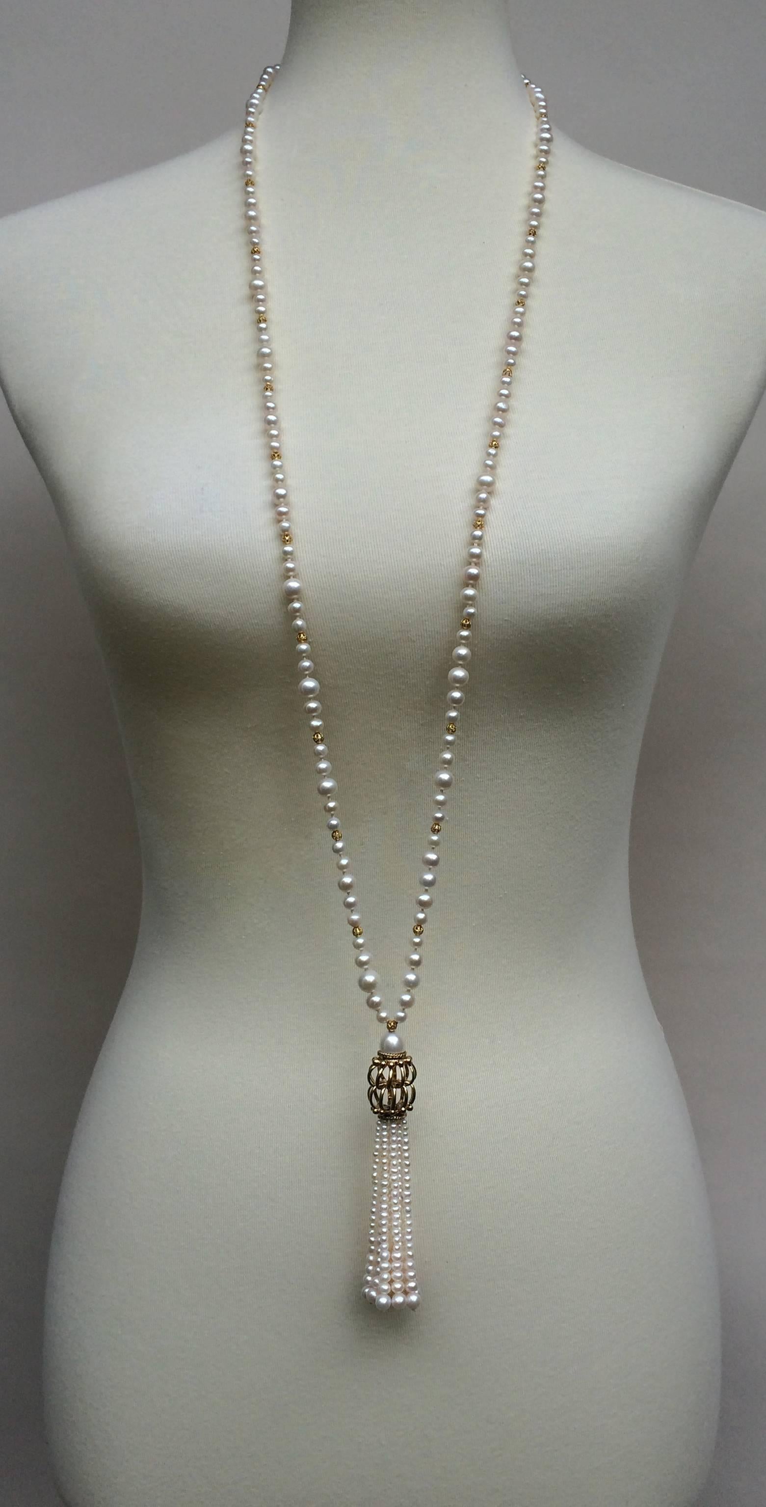 Multiple slight graduations give this beautiful piece an illusion of movement. Smooth and round pearls ranging from 2.5 mm- 6 mm round are graduated back to back and divided by small filigree gold plated silver beads. The strand of pearls flow into