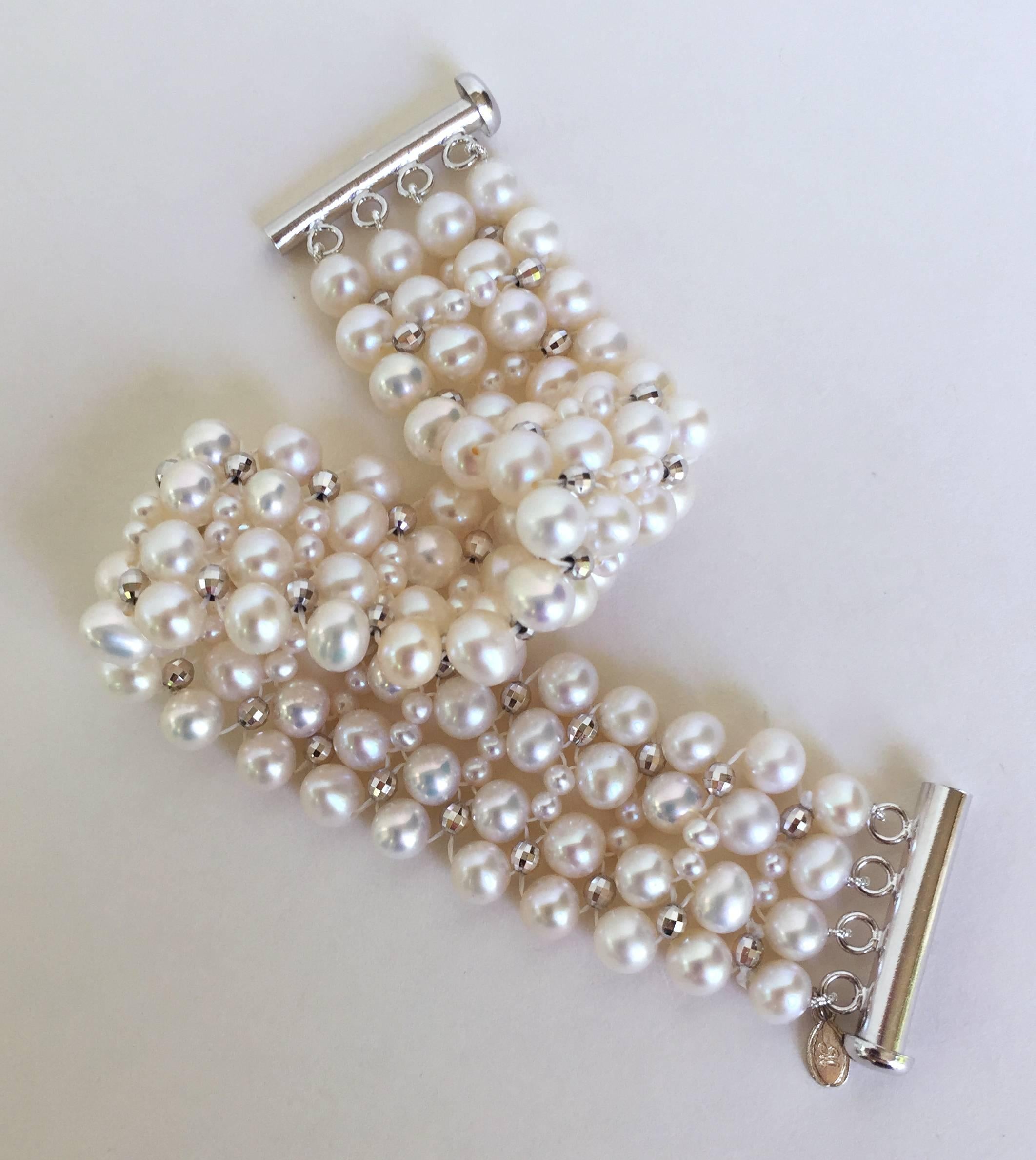 This 1920's inspired white pearl bracelet has silver rhodium plated beads woven into the design to add that extra touch to this classic bracelet. All the silver beads and the clasp are silver rhodium plated to protect the bracelet from wear and