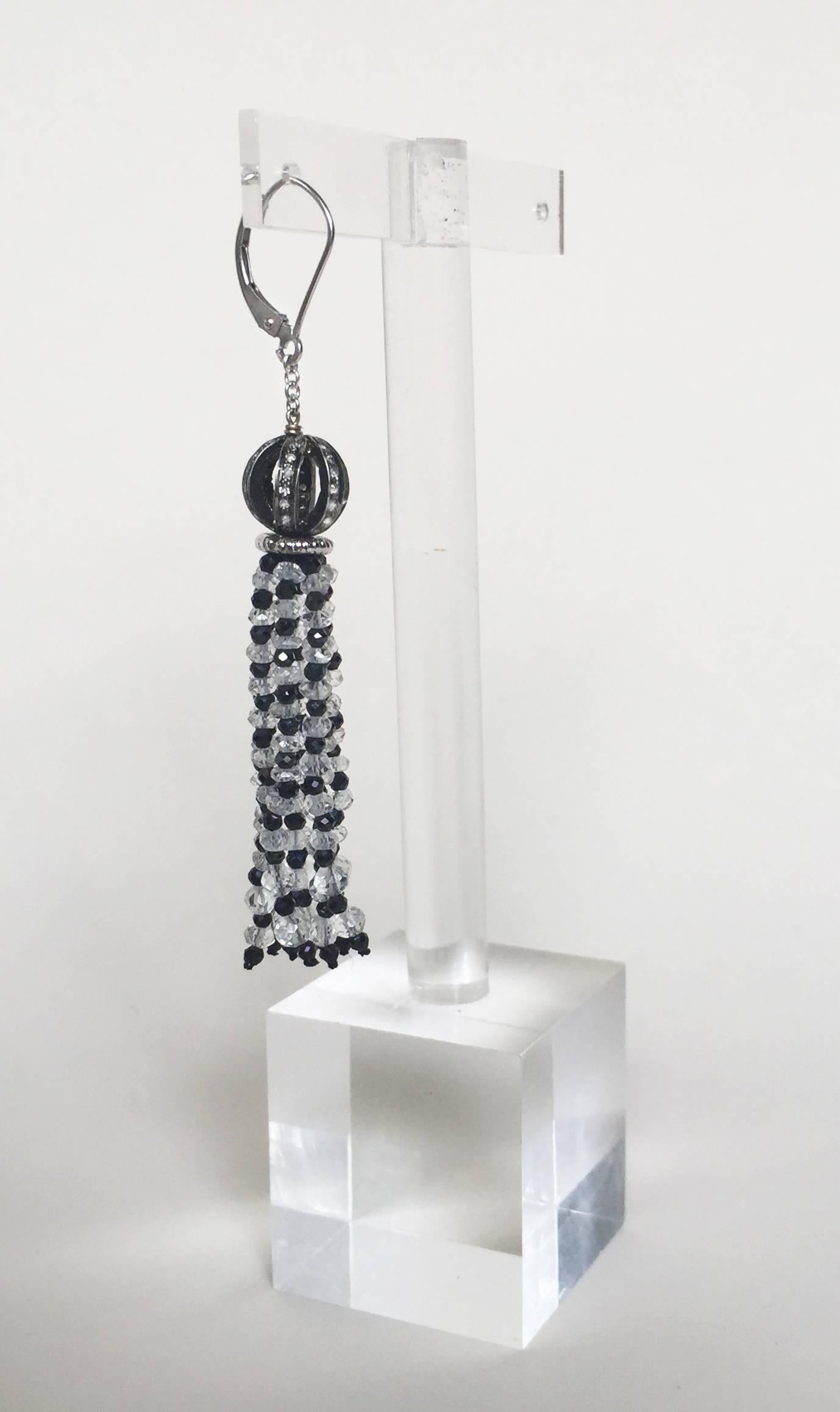 These one of kind earrings designed by Marina J are striking for there quartz and black spinel patterned tassels. They are reminiscent of the Art Deco movement, giving them an air of elegance and whimsy. The earrings are crowned with diamond