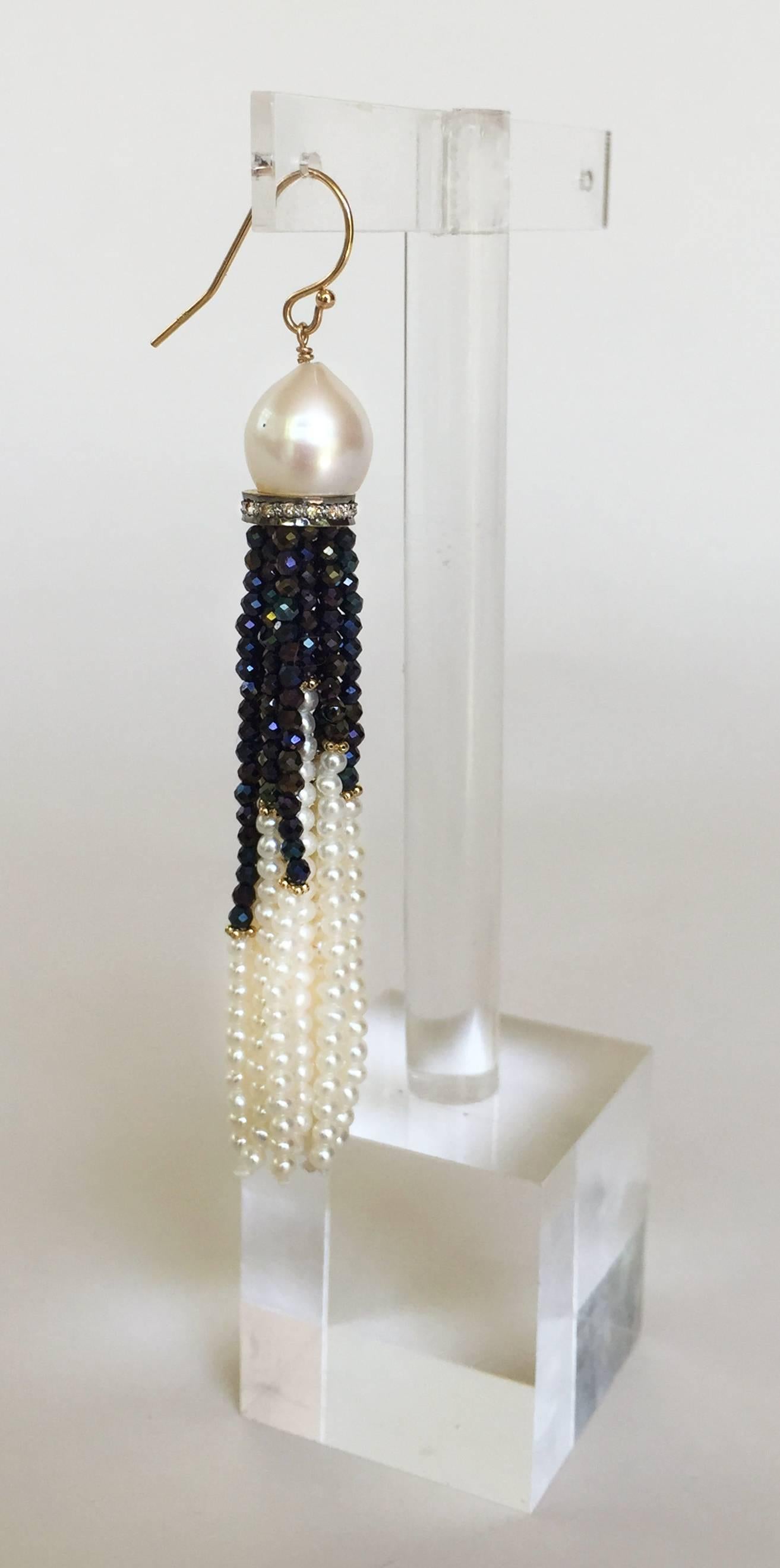 This beautiful pair of tassel earrings is composed of diamond encrusted sterling silver rhondels and are finished with gorgeous 1.5mm black spinel and pearl  beaded tassels. The tassels are highlighted with small gold divider at different spots of