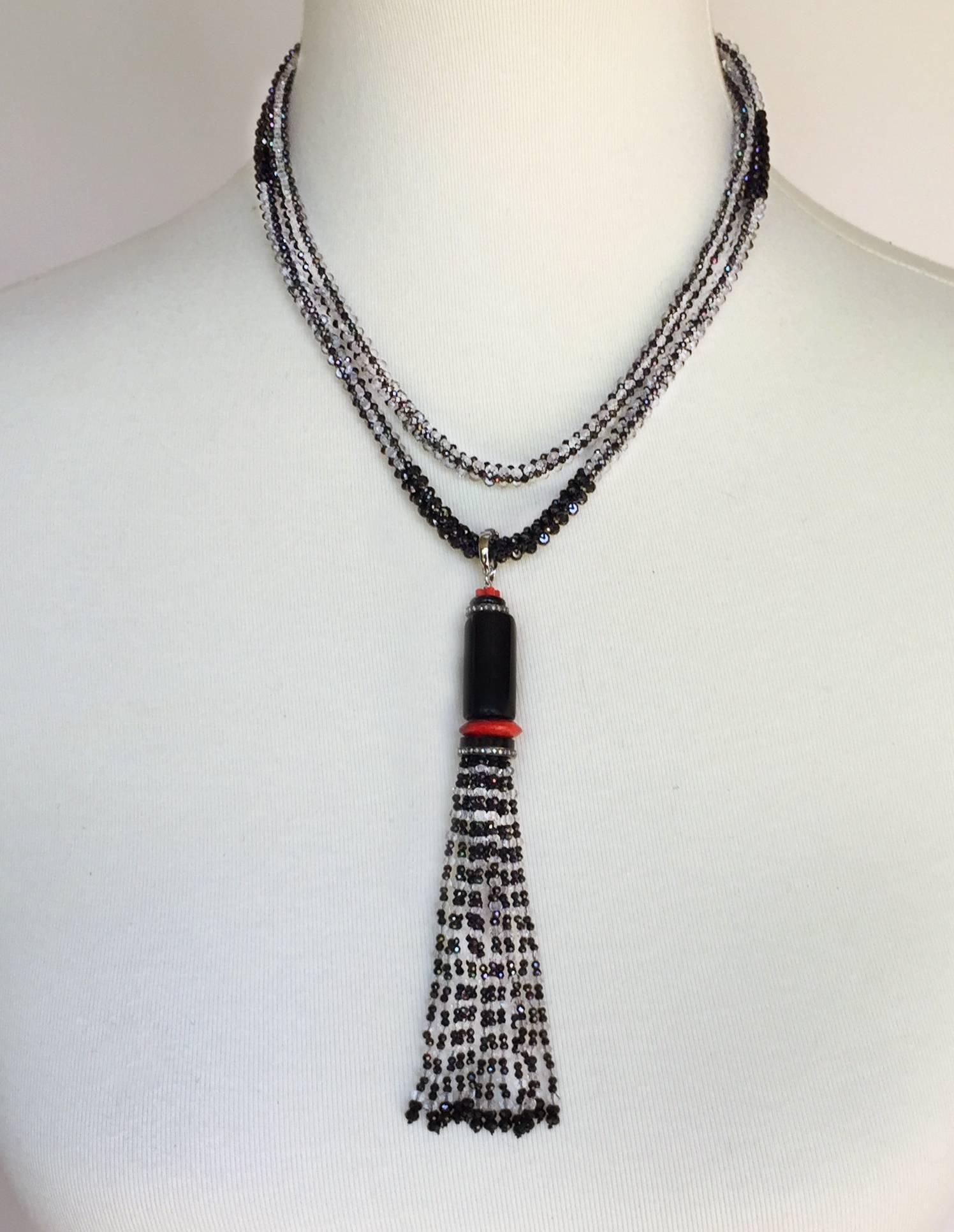 This one of kind Marina J design had a black spinel and white topaz patterned woven rope-like sautoir. The statement tassel sparkles with black spinel and white topaz checkered strands, bringing a modern and elegant touch to the necklace. A large