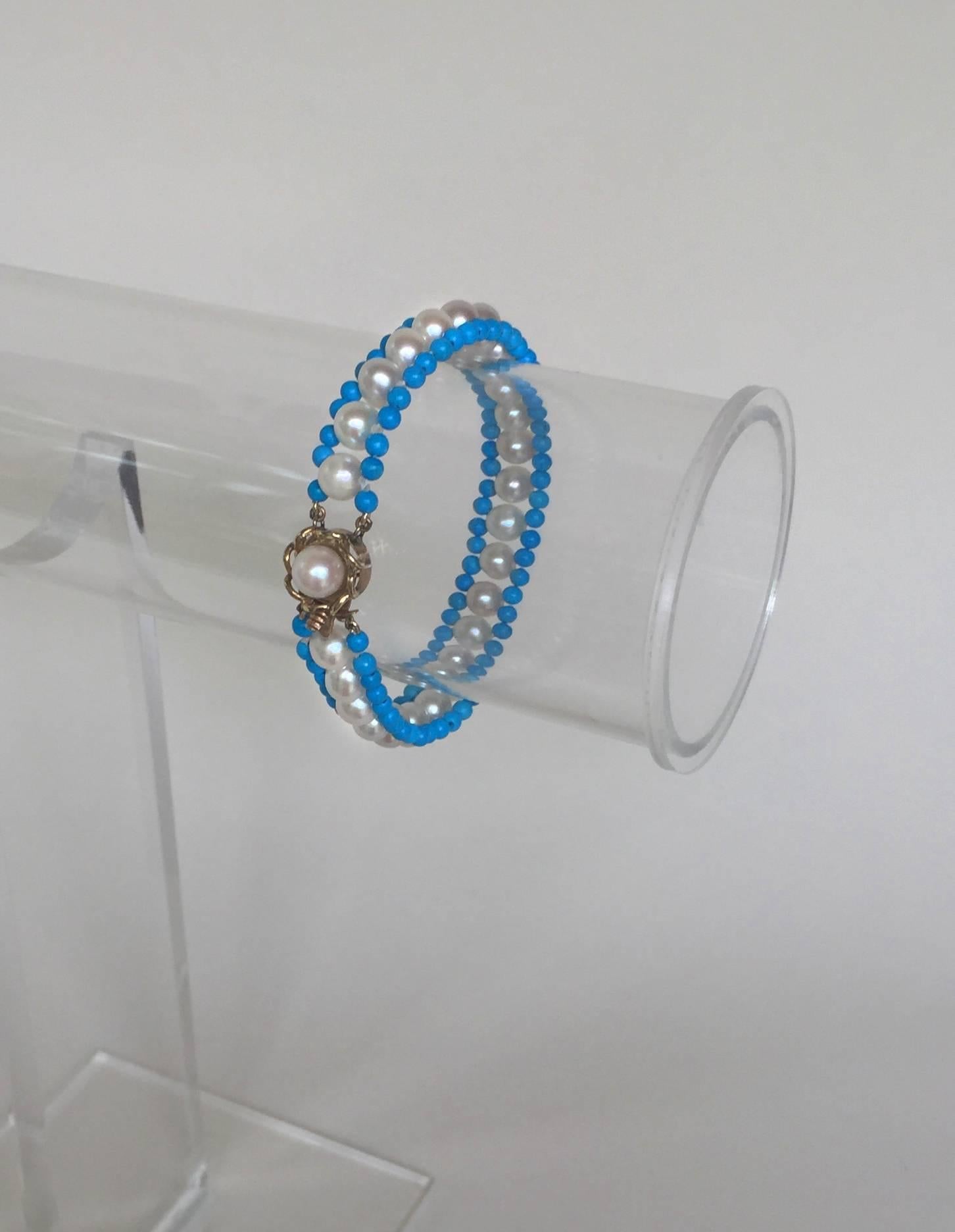 This bracelet has beautiful round pearls and brilliant blue turquoise beads that are highlighted with a floral-like 14k yellow gold clasp. The clasp is easy to handle and secure. It measures at 7.5 inches to fit elegantly to the wrist. The