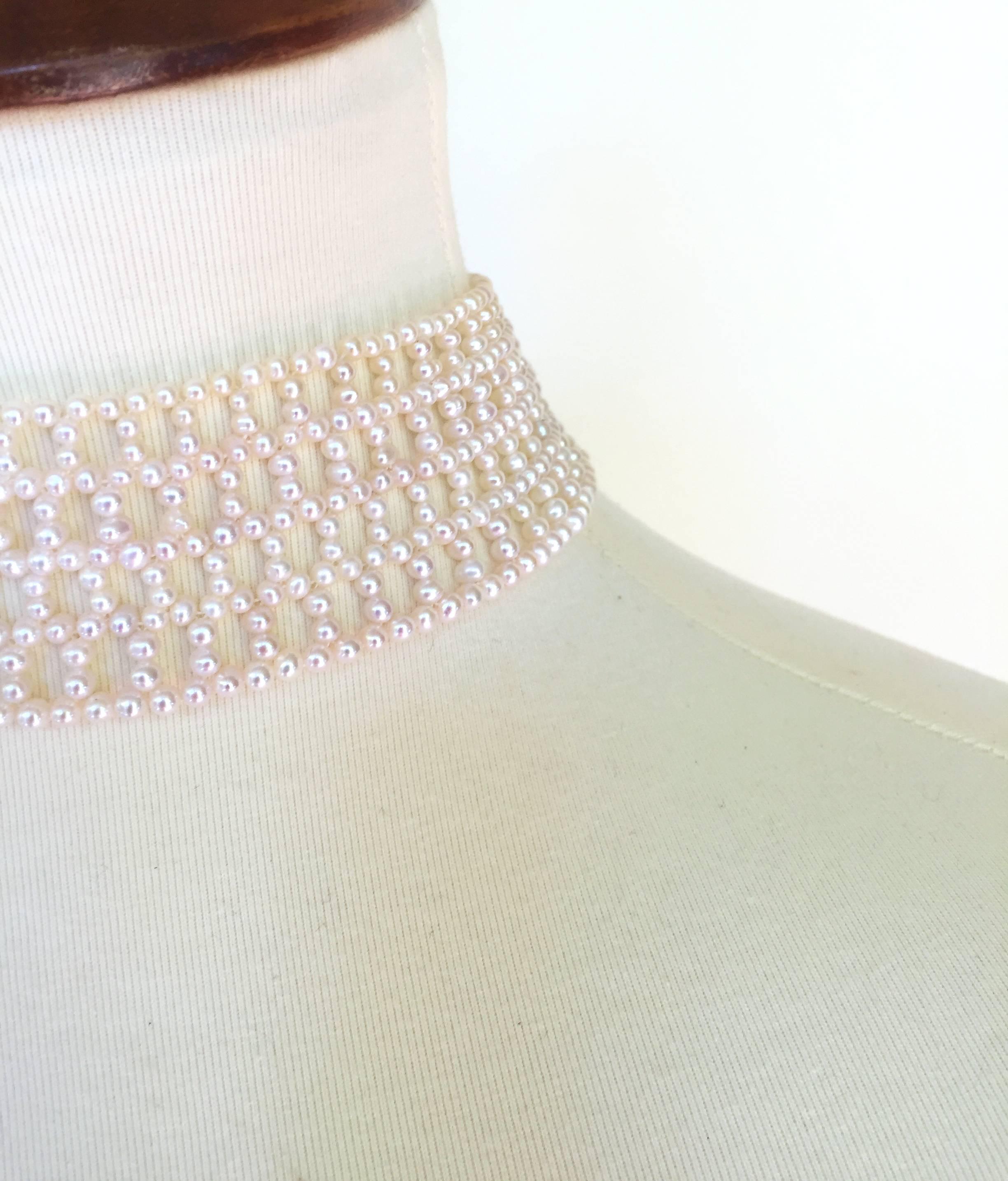 The intricately wide woven white pearl choker is classic with the double stranded 3 mm pearls and 14k white gold clap.  Because of the weave of the choker you can change the style by adding any brooch (as seen in images) (Brooch and tassel not