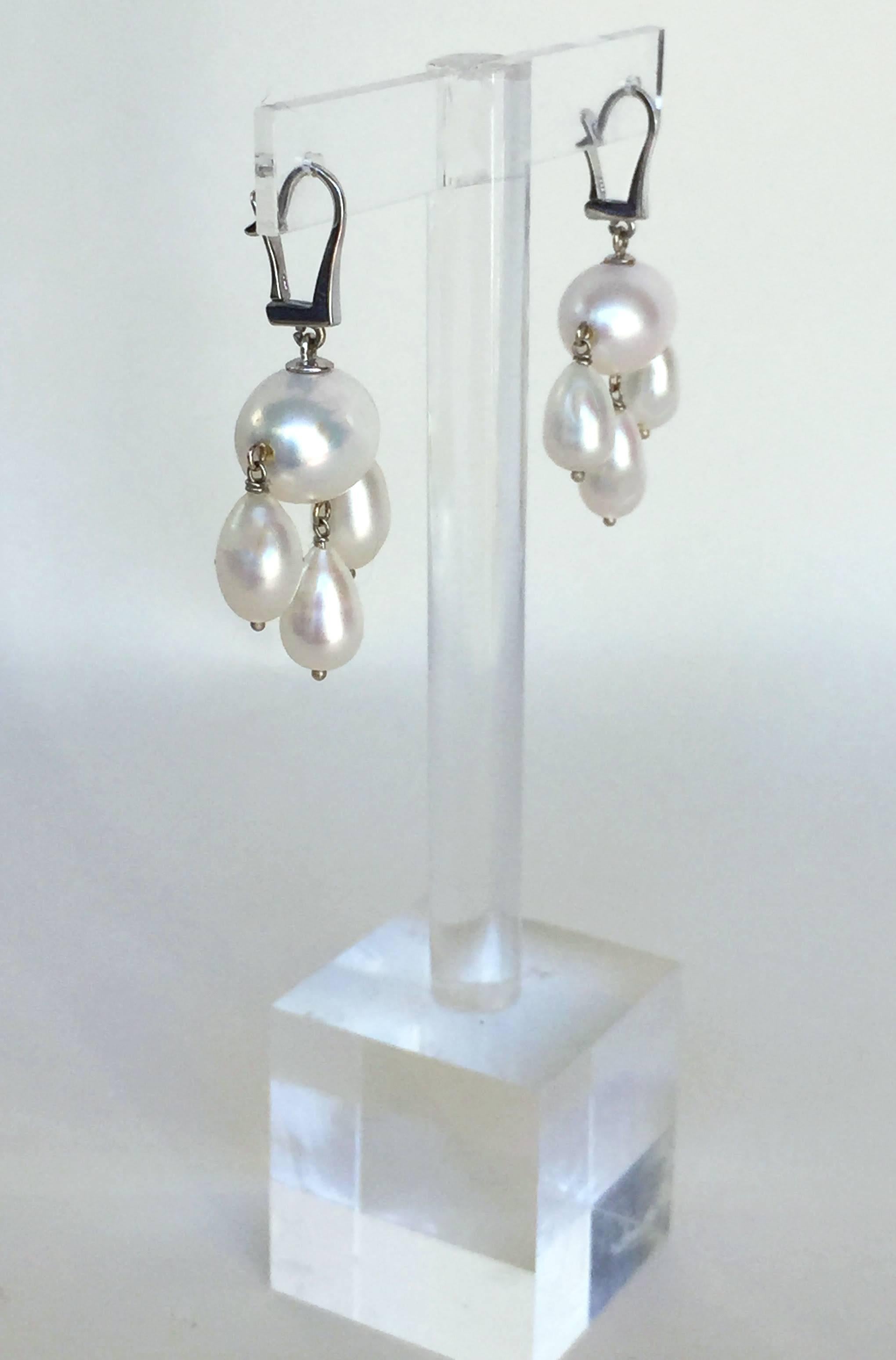 These pearls were chosen by Marina J glistening white color. They are highlighted by the 14k white gold finish and lever back. They dangle at 1.5 inches, a wonderful reinvention of the classic pearl earrings. These white pearl dangle earrings are