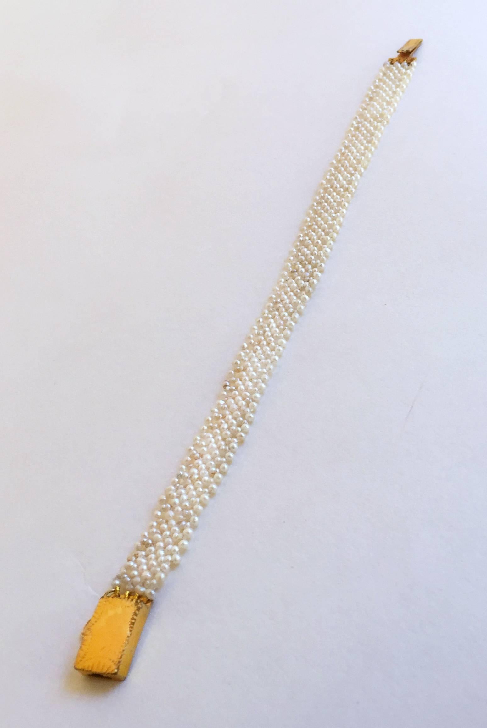 The classic Marina J design woven 1mm pearl bracelet fits delicately on the wrist, yet the weave is doubles stranded for durability. The lace-like design is completed by an English vintage  yellow gold clasp. The bracelet is 6.75 inches long. This