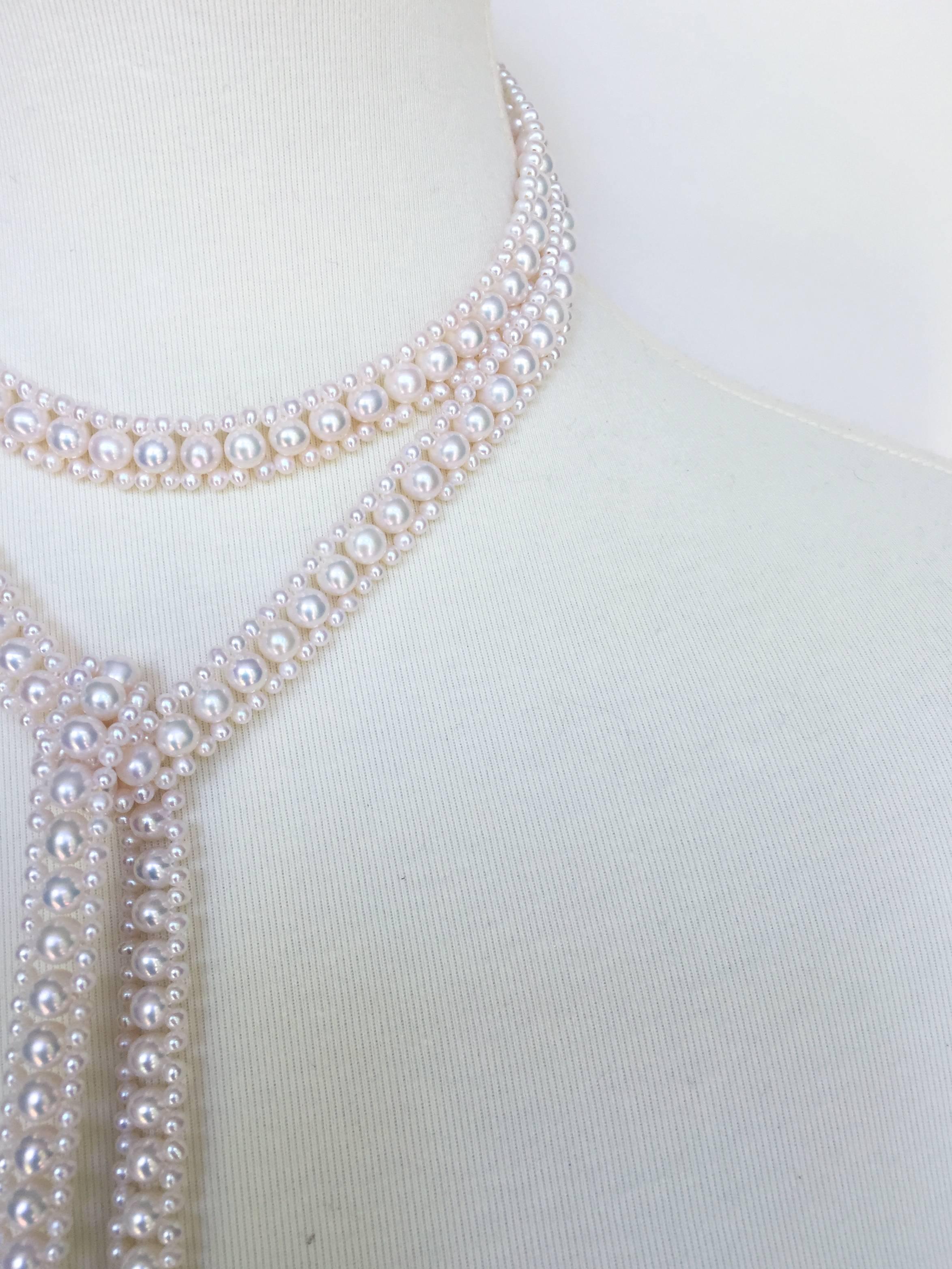 This elegant sautoir is woven into a rope design with round pearls (5.5 mm)  and smaller round pearls (2mm). The tassel is starts off with a large round half pearl and diamond encrusted roundels, finishing off with graduated pearl strands. This