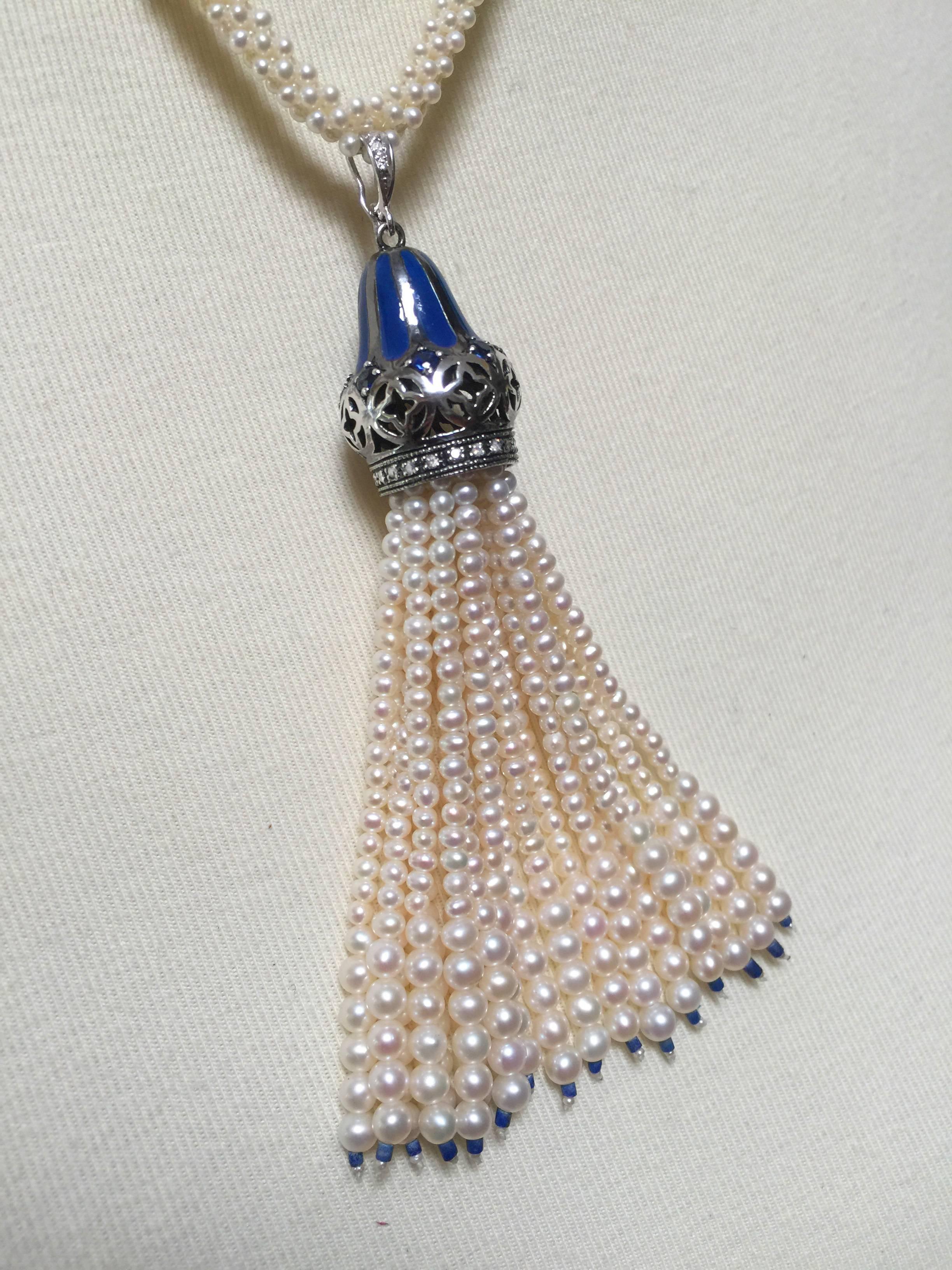 Woven into a rope-style lariat necklace with pearls and lapis-lazuli beads, this one-of-a-kind handmade piece may be worn with or without tassel, allowing for different shapes and style choices. The tassel starts with a sterling silver with a