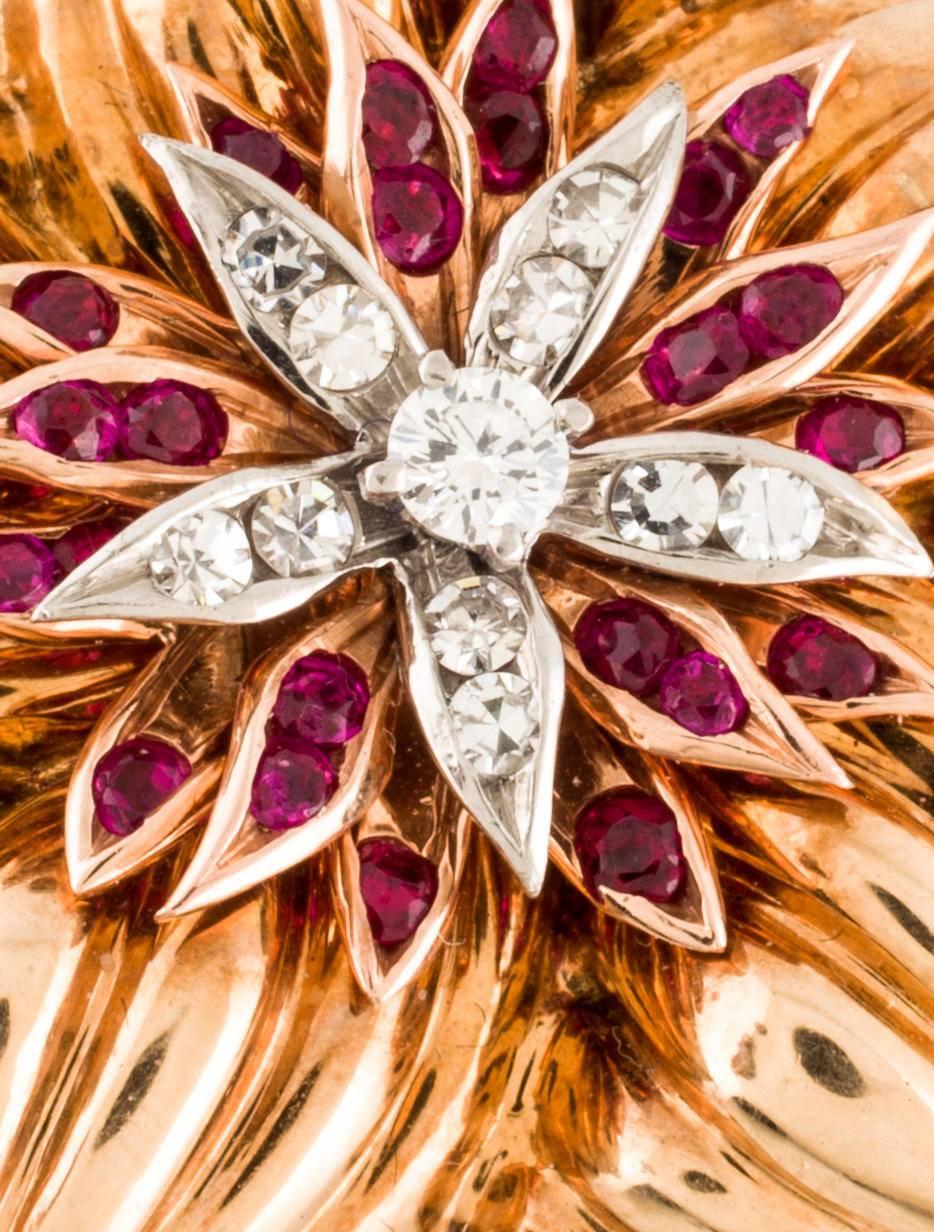 14K yellow and white gold Cartier ruby and diamond star brooch with pin closure.

Metal Type: 14K Yellow Gold, 14K White Gold
Hallmark: 14K
Signature: Cartier
Location: Back of Piece
Metal Finish: High Polish
Total Item Weight (g):