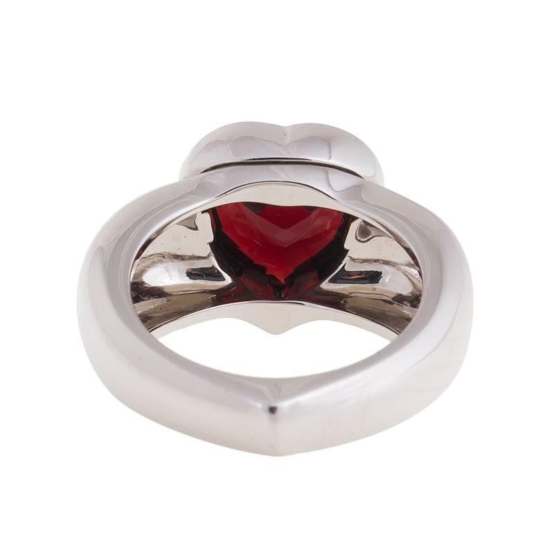 18K White Gold Garnet Ring 
Features:
Brand: Piaget
Gender: Womens
Condition: Brand New
Ring Size: 7
Metal: 18k White Gold
Stone: Garnet
Retail: $4,750.00