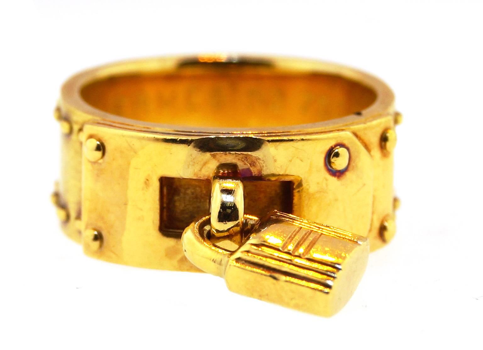 Gorgeous and iconic Hermes padlock ring in 18k gold. 
Designed in the 1970's this ring comes with it's original vintage Hermes box. Ring size 6.