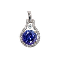 Pendentif en or blanc massif 14K avec 2cts de Tanzanite et diamants extraits de la terre  RD 8mm