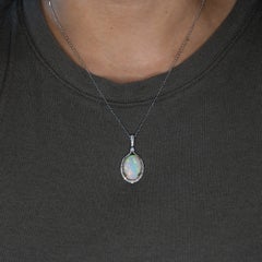 8.4Ct Ethiopian Opal Pendant with Earth-Mined Diamonds: Solid 14K Gold, 18x13mm