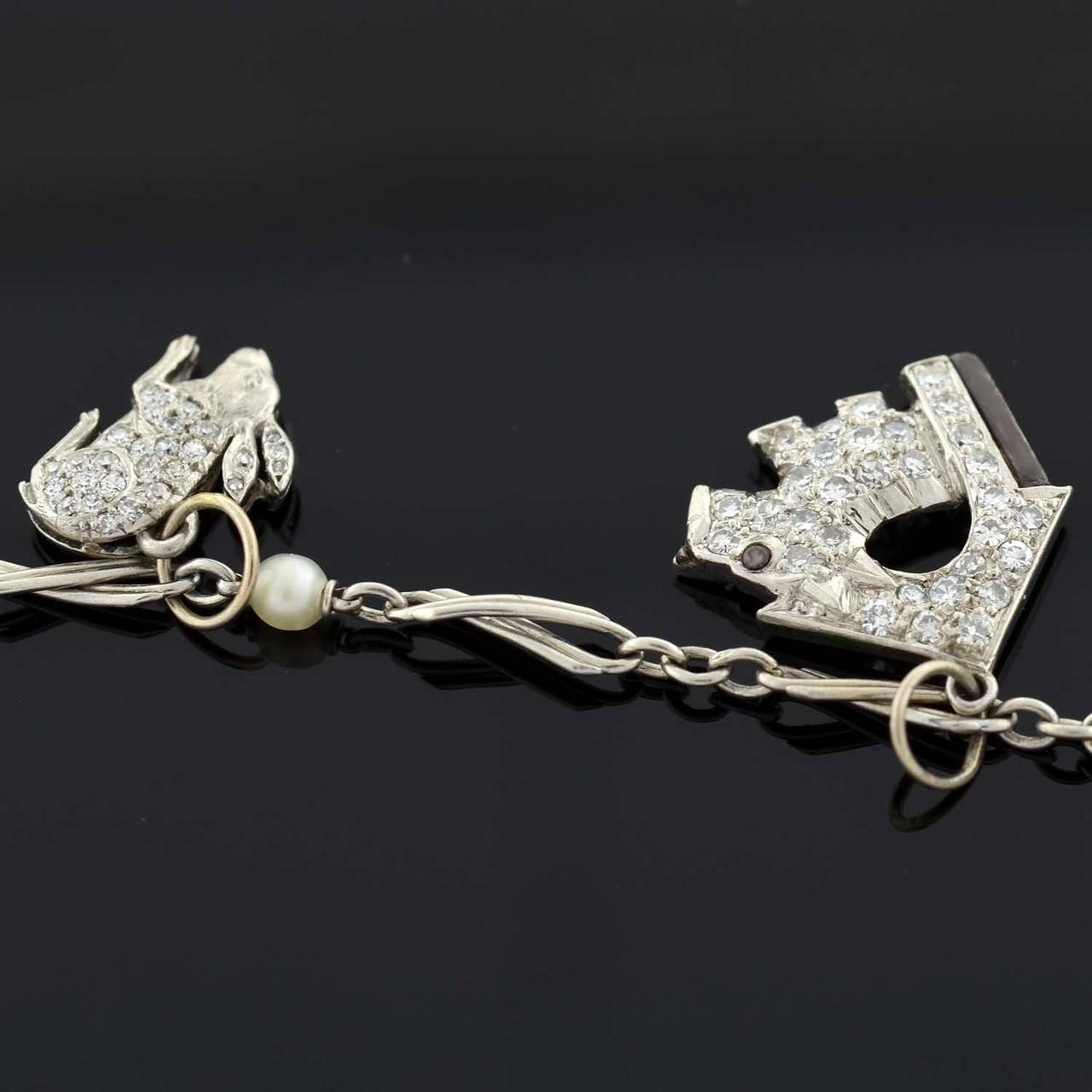 Art Deco Emerald Diamond Platinum Multi Charm Bracelet at 1stDibs