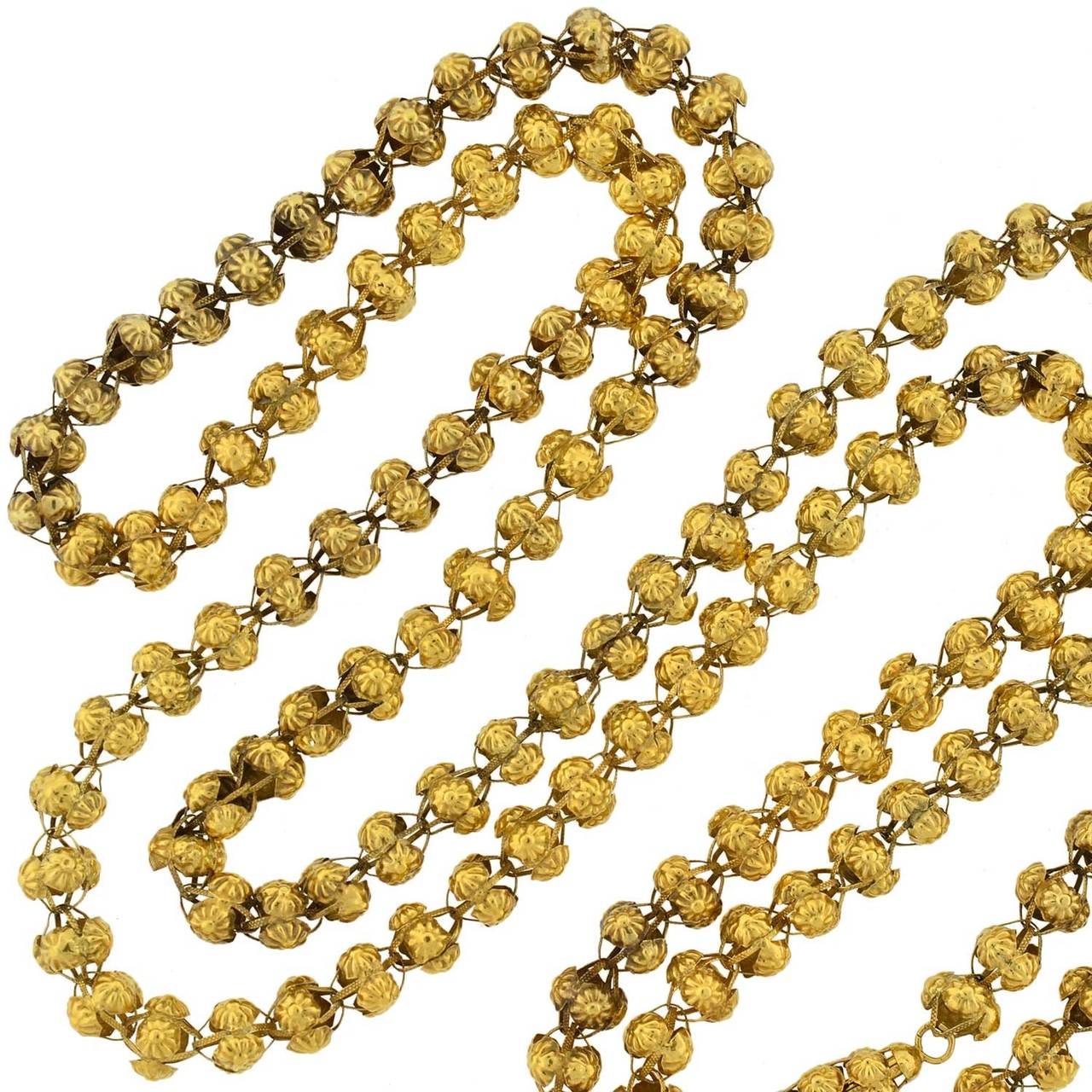 This beautiful and rare gold necklace is from the Georgian era (circa 1750) and makes a wonderful statement! The lovely design is comprised of handmade open bead links, which are crafted in vibrant 15kt yellow gold (indicating English origin). Each