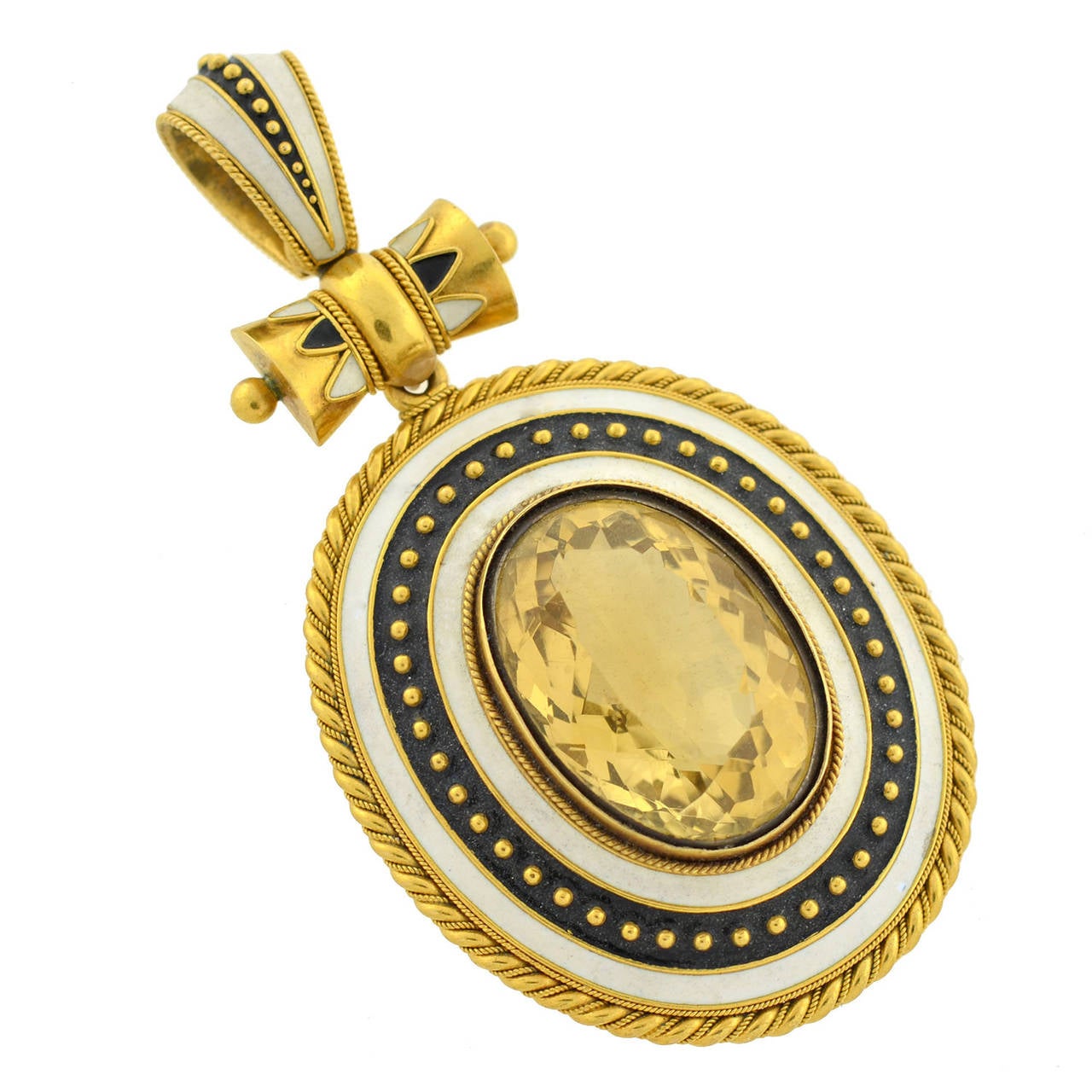 A magnificent citrine locket pendant from the Victorian (circa 1880) era! Made of vibrant 15kt yellow gold (indicating English origin), the piece is oval in shape and particularly large in size. A wonderful enameled border surrounds a faceted