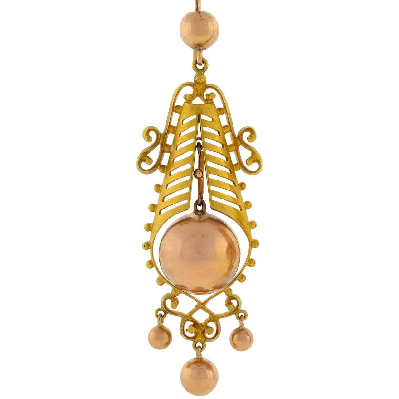 Absolutely exquisite gold earrings from the Victorian (ca1880) era! Each earring, which is fairly large in size, is made of vibrant 15kt yellow and rose gold and is beautifully decorated with a very unusual and lovely design. The earrings, which