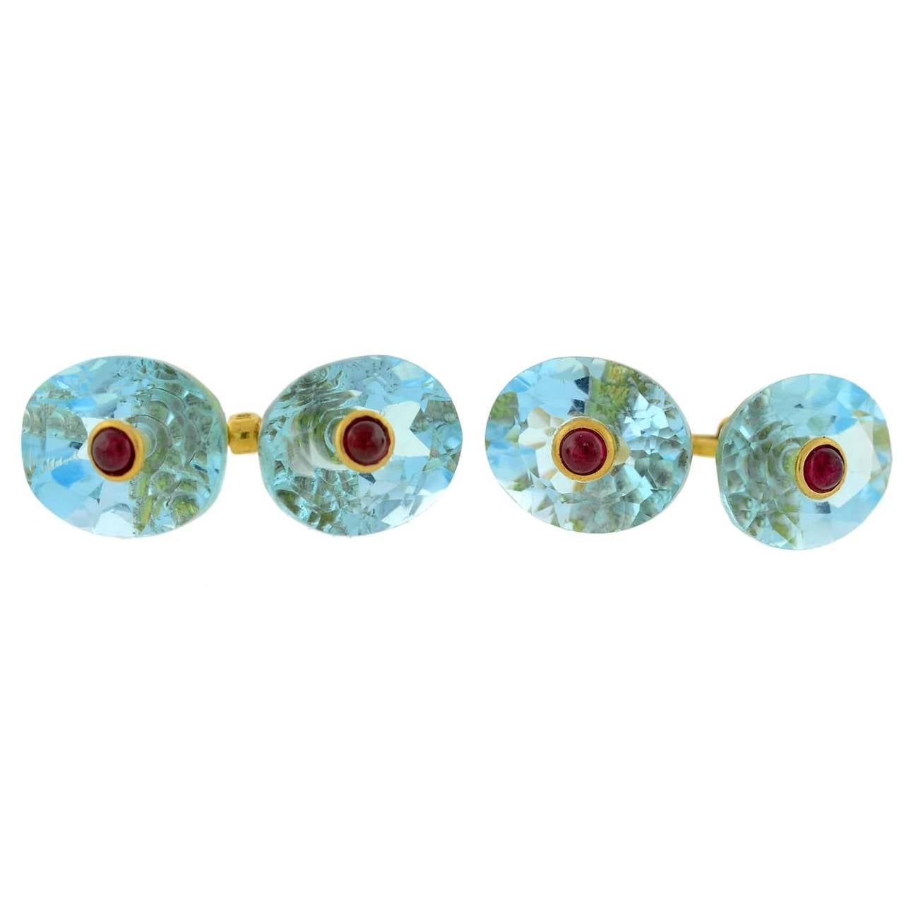 A very attractive and unusual cufflink set from the Retro (ca1940) era! Included in this 5-piece set is a pair of double-sided cufflinks and 3 matching shirt studs. Each double-sided cufflink is comprised of an oval-shaped blue topaz face with