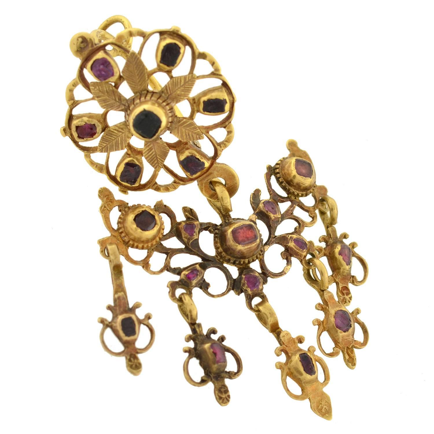Absolutely exquisite garnet earrings from the Georgian (ca1780) period. These unusual and incredible earrings are particularly large in size and have a magnificent and royal-looking appearance. Each is made of 18kt yellow gold and detailed with 20