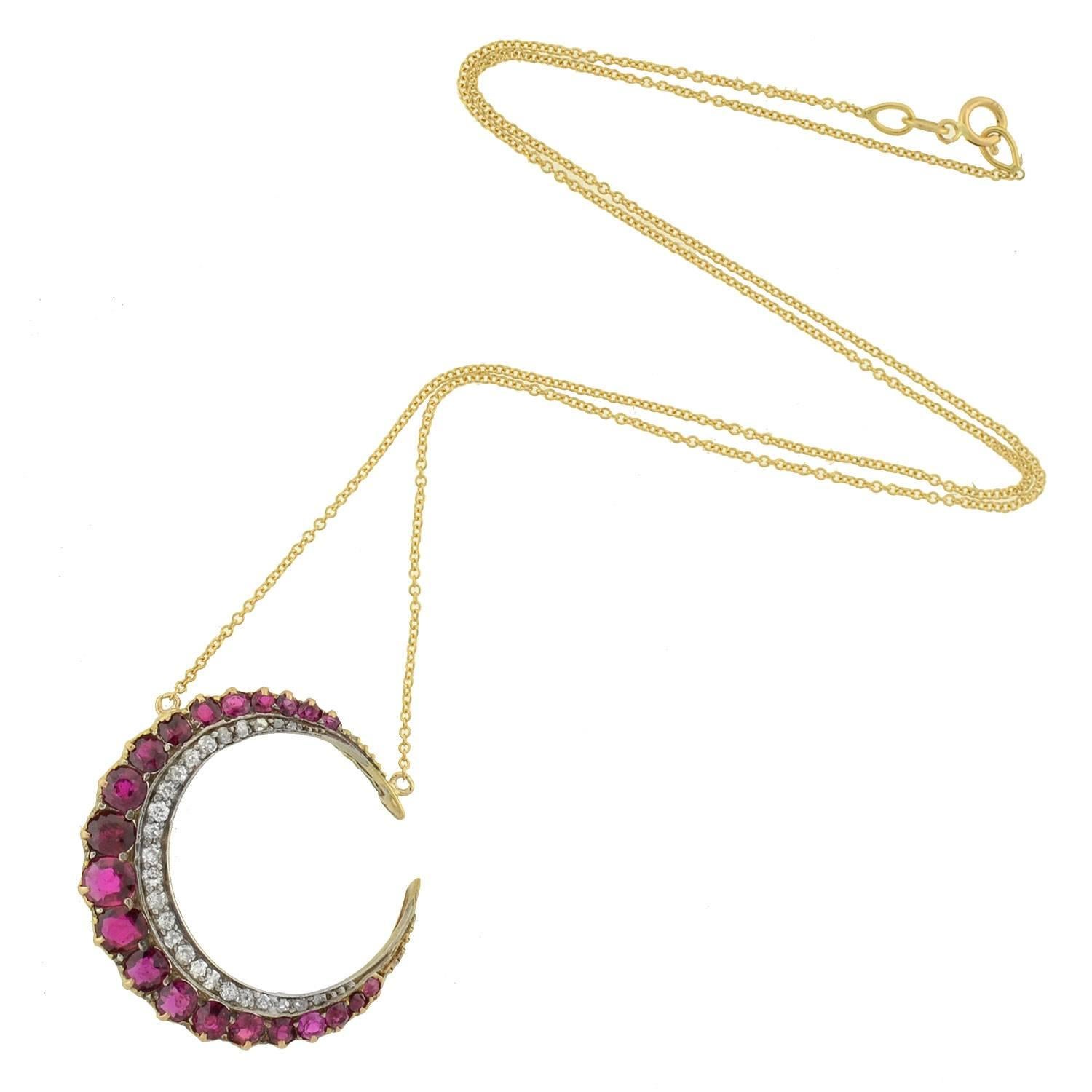 An absolutely breathtaking ruby and diamond crescent from the Victorian era (ca1880)! Made of sterling topped 14kt yellow gold, this gorgeous necklace is comprised of a single crescent moon pendant that hangs from a vibrant modern yellow gold chain.