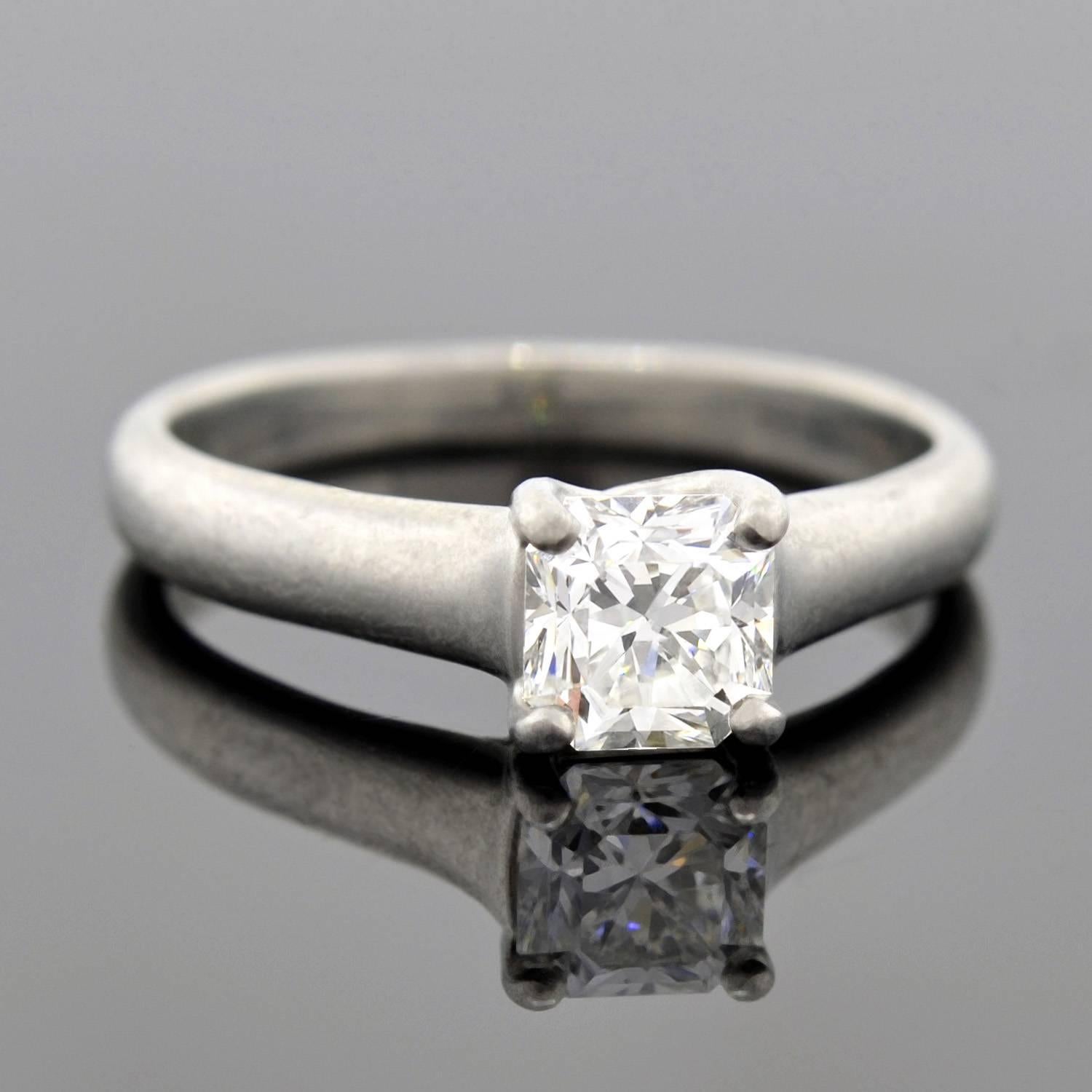 This gorgeous estate diamond engagement ring is an original Tiffany & Co. design! Named the "Lucida ®" Diamond ring, it features a beautiful mixed cut diamond at the center of a platinum solitaire setting.

As described by Tiffany