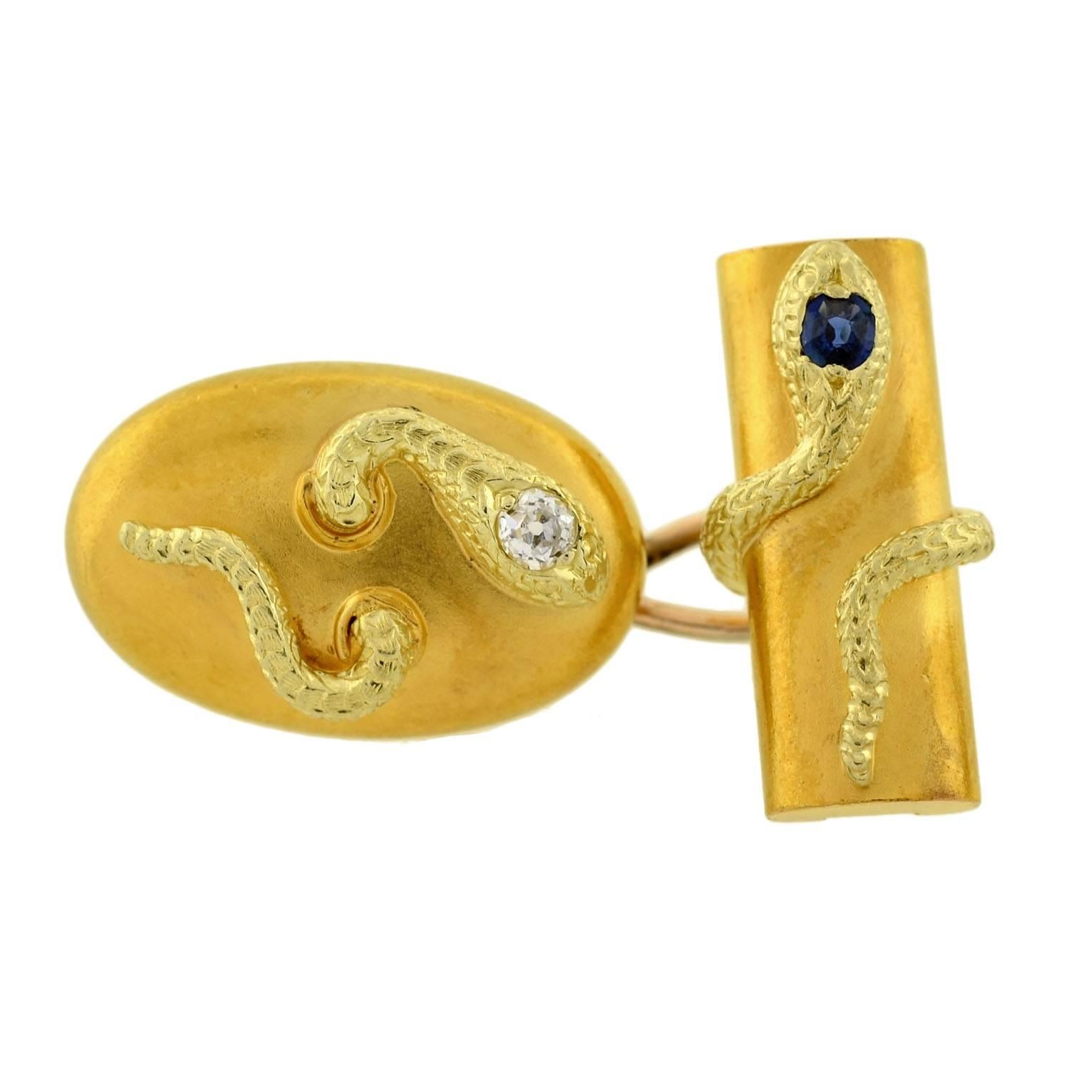 An unusual pair of 18kt gold snake cufflinks from the Victorian (ca1880) era! Each of these double-sided cufflinks has an artistic snake motif in raised 3-dimensional detail. A single serpent appears to weave through the surface of the oval link,