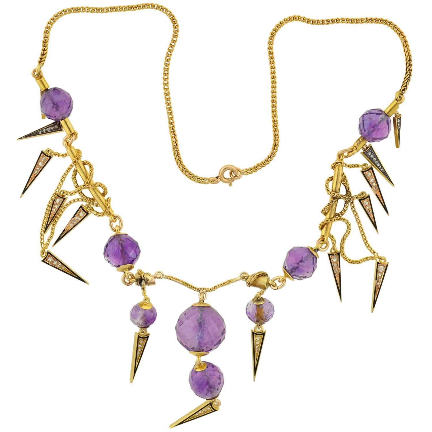 An elaborate amethyst necklace from the Victorian period (ca1880)! This magnificent piece is crafted in 14kt yellow gold, and has a very decorative festoon design. There are 8 amethyst beads interspersed throughout the piece, each with a
