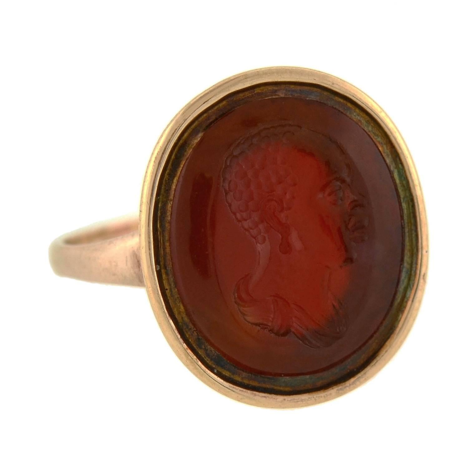 The opposite of a cameo, an intaglio is created by carving below the surface to produce an image in relief, with the purpose of pressing into sealing wax. Intaglios were often used incorporated into signet rings to sign and seal the wax of a letter