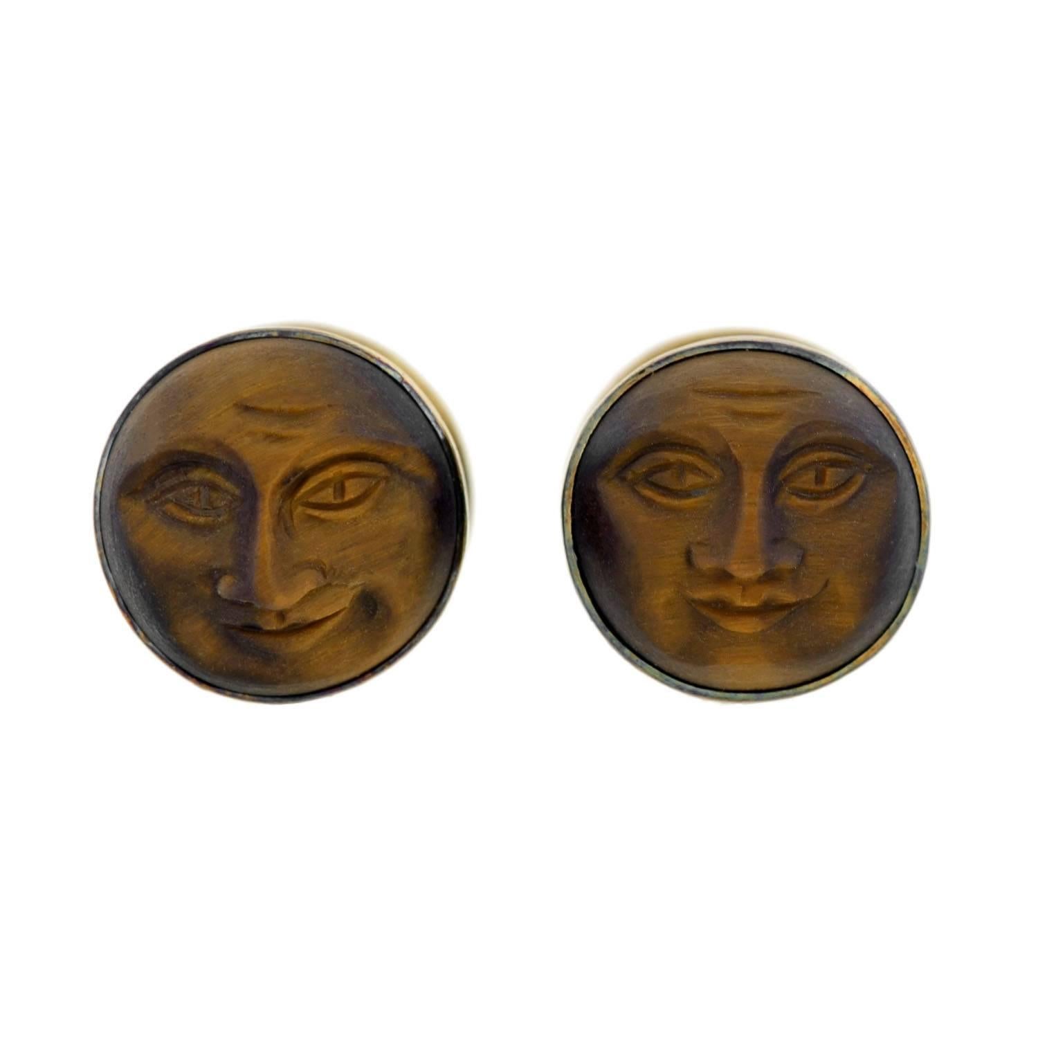 A rare and unusual pair of cufflinks from the Victorian (ca1880) era! Each double-sided cufflink has two carved tiger's eye stones with a 