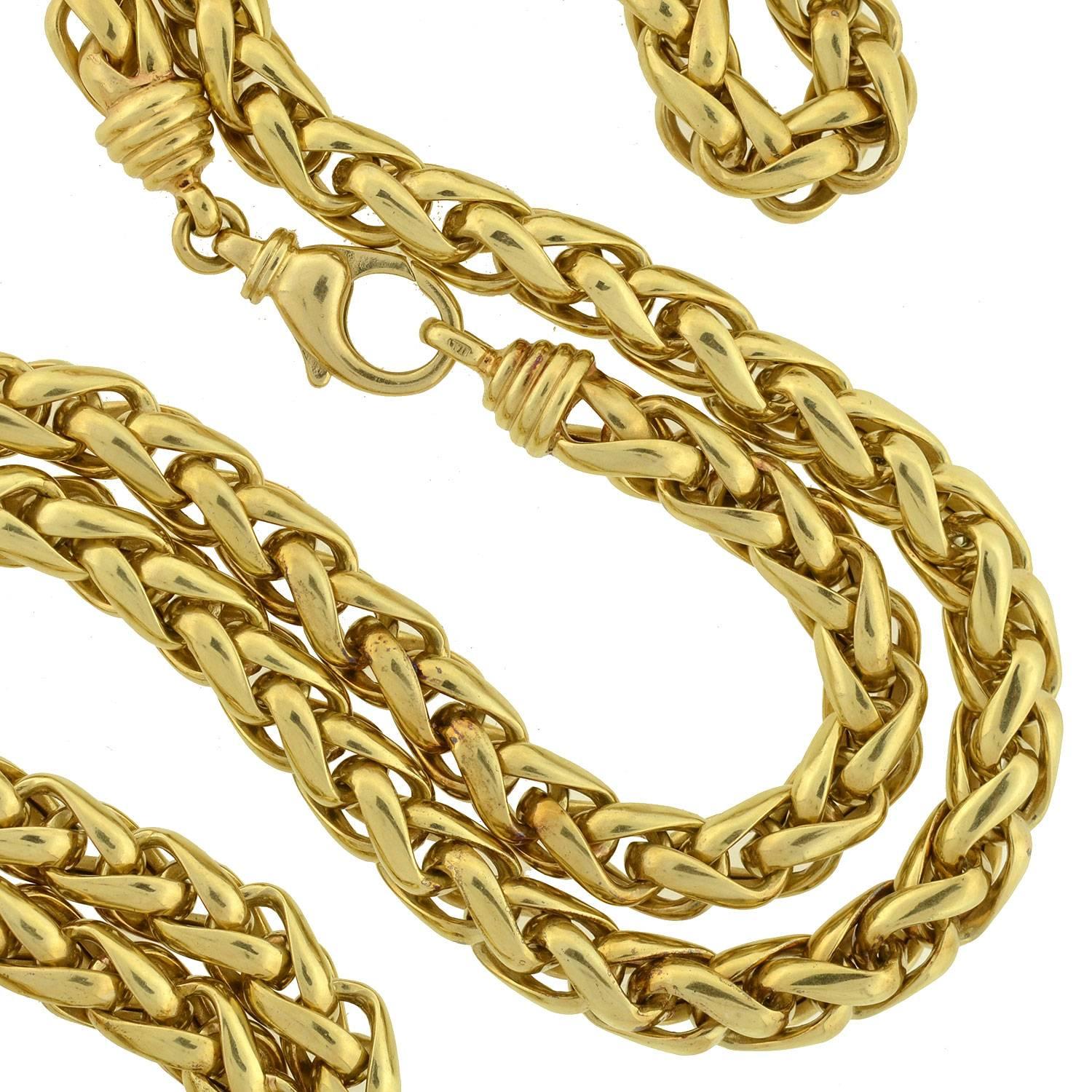 A fabulous Estate necklace with a bold, stylish look! Made of 14kt yellow gold, the gorgeous piece is comprised of 36" of generously sized links which form an eye-catching braided design. The thick rope pattern carries throughout the entire