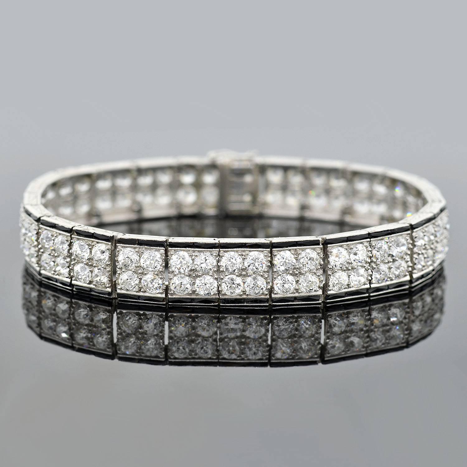 An absolutely stunning line bracelet from the Art Deco (ca1920) era! This dazzling piece features 100 sparkling old European Cut diamonds that wrap around the wearer's wrist in a glittering double row. Made of platinum, the bracelet is comprised of